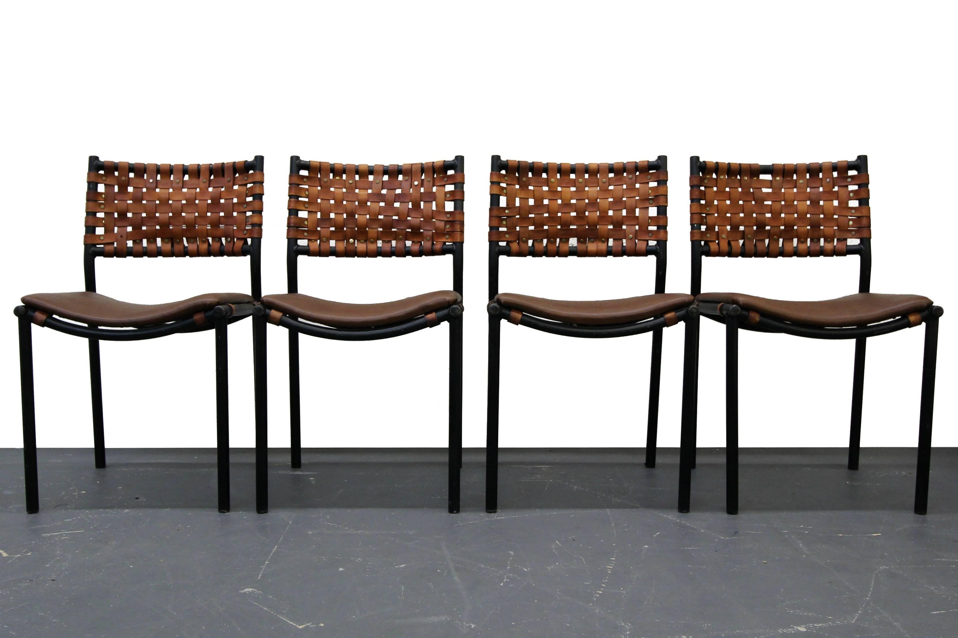Set of four, perfectly patinaed, woven leather, dining or patio chairs by Arthur Umanoff for Shave Howard. Chairs have beautifully worn woven leather for that great Industrial look. 

The chairs are in beautiful worn Industrial condition. The