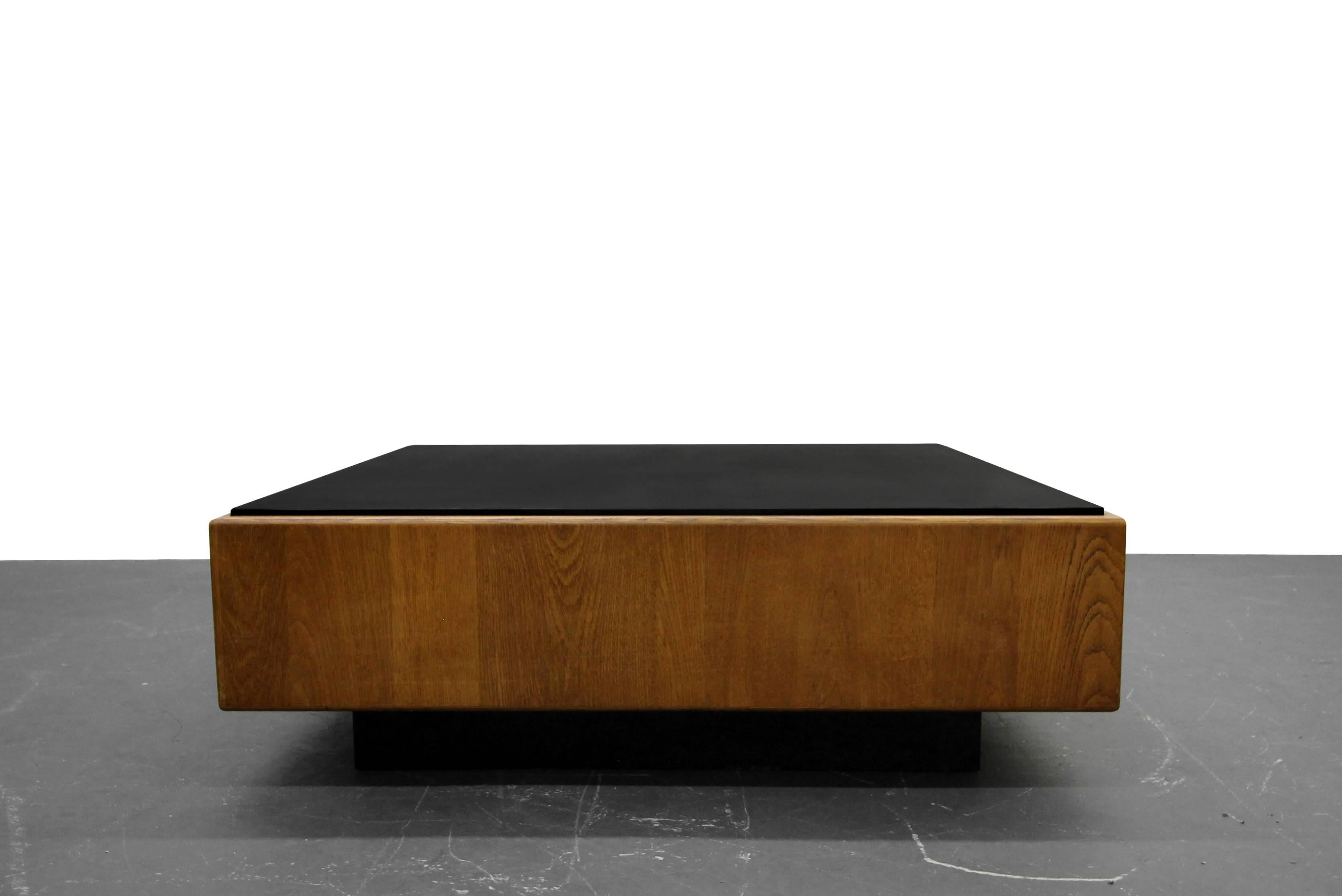 This is a massive piece, a statement piece. Comprised of a beautiful rounded oak framework and topped in black slate floating on a plinth base. Designed by the infamous Milo Baughman.

 