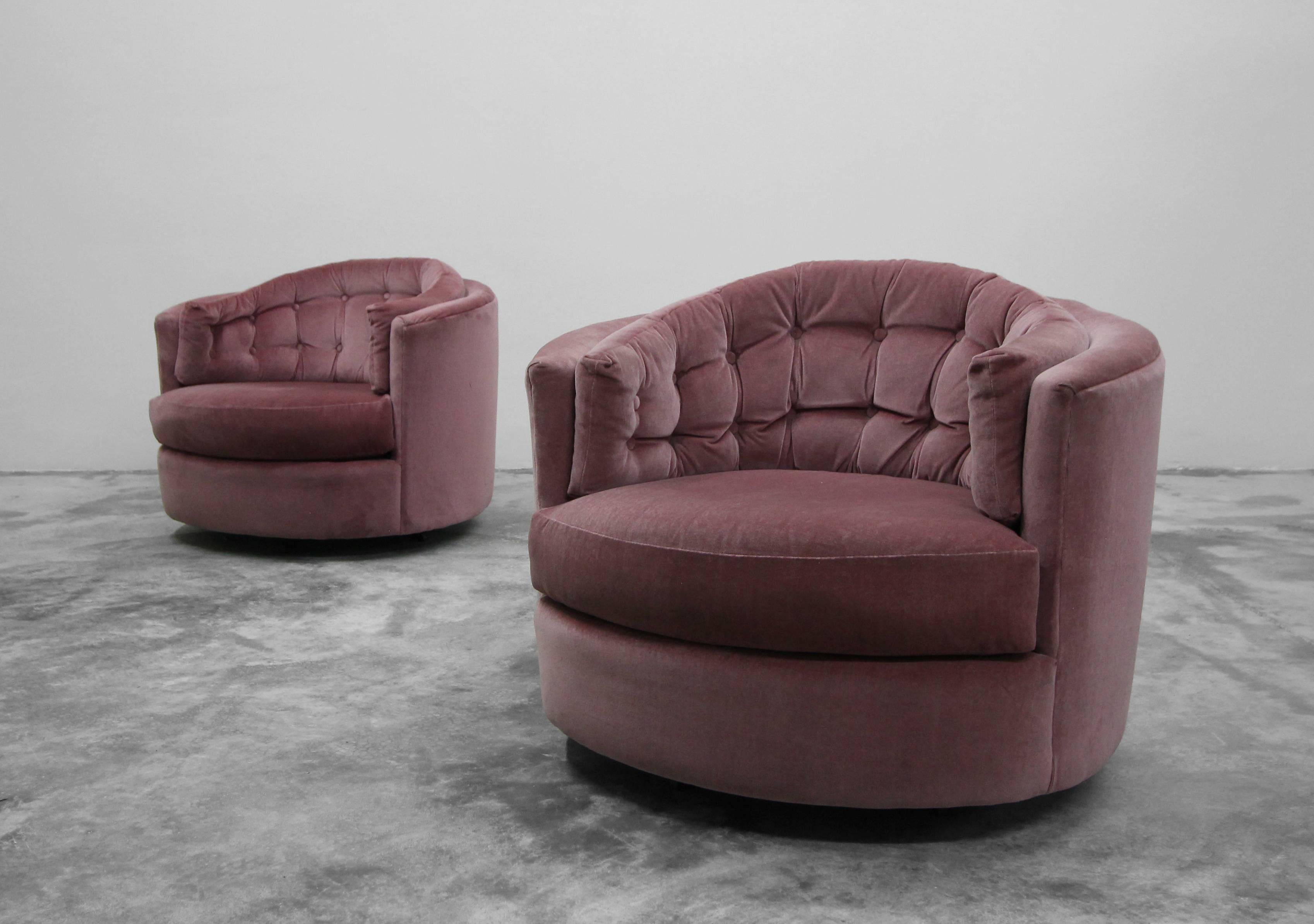 Nice pair of midcentury rocking swivel barrel chairs by Milo Baughman. Perfect pair. Beautiful mauve velvet fabric.

Chairs sold as found. Fabric is in good usable condition with no odors, rips tears or stains, minimal wear. Chairs swivel well.