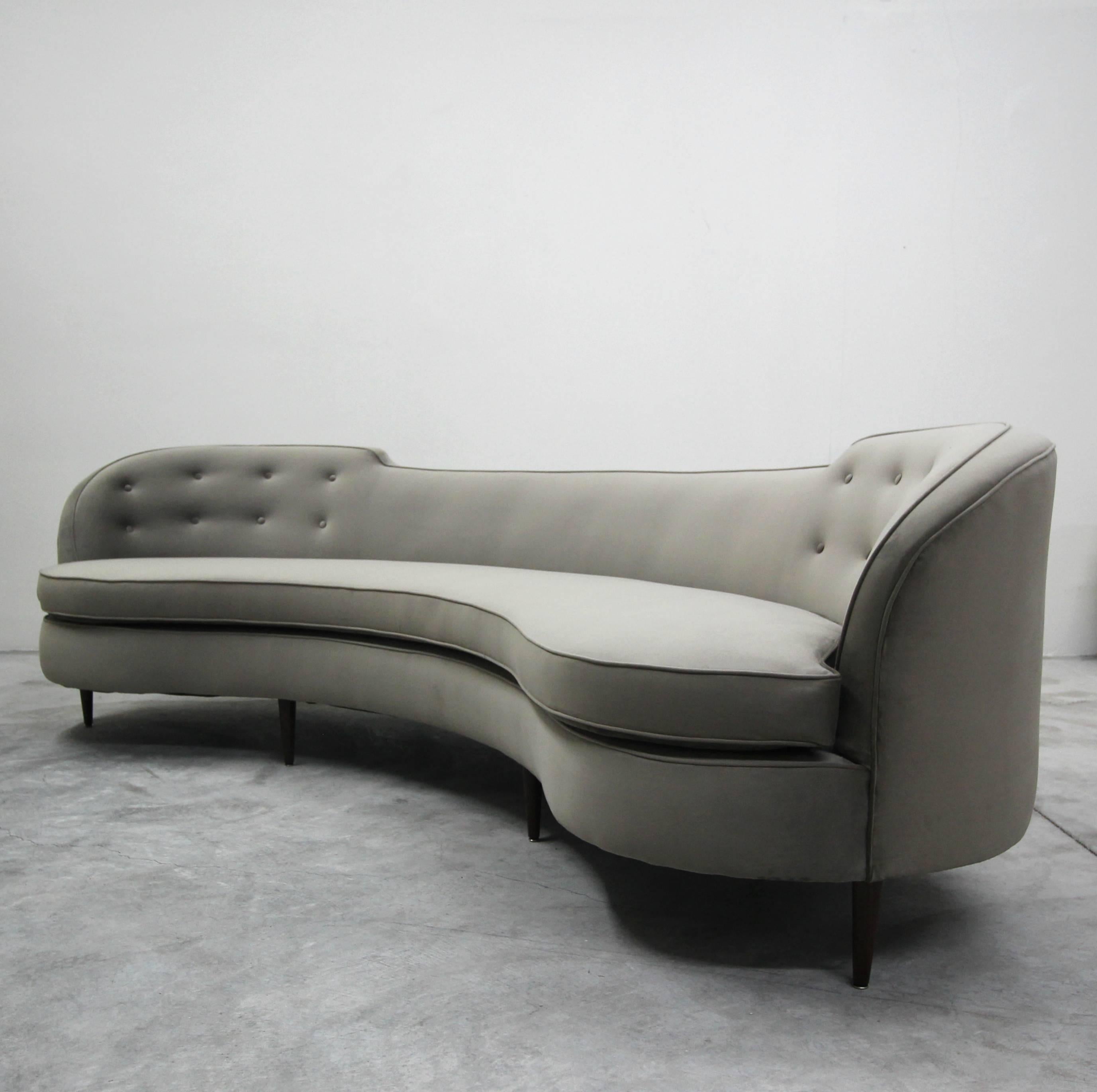 A rare classic to behold in this stunning vintage Edward Wormley for Dunbar sofa. Why settle for a modern replica when you can have the quality and authenticity of the real deal. The rounded lines of this gorgeous sofa combined with its large size