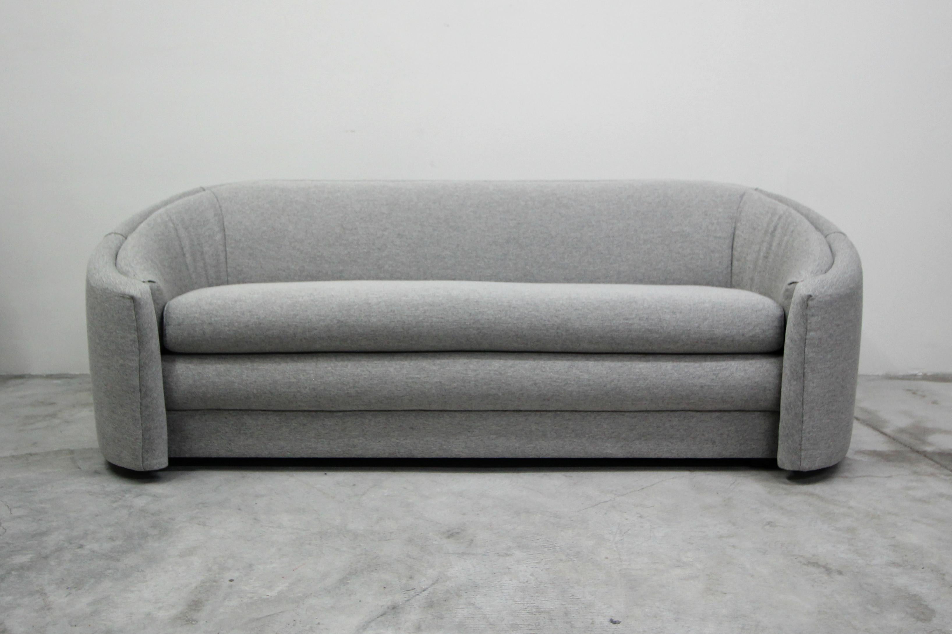 The perfect midcentury sofa with hints of Regency style swag. If you've been looking for that perfect sofa that can mesh into several styles this beauty will not disappoint. Her lines and curves give her mass appeal and her perfectly rounded