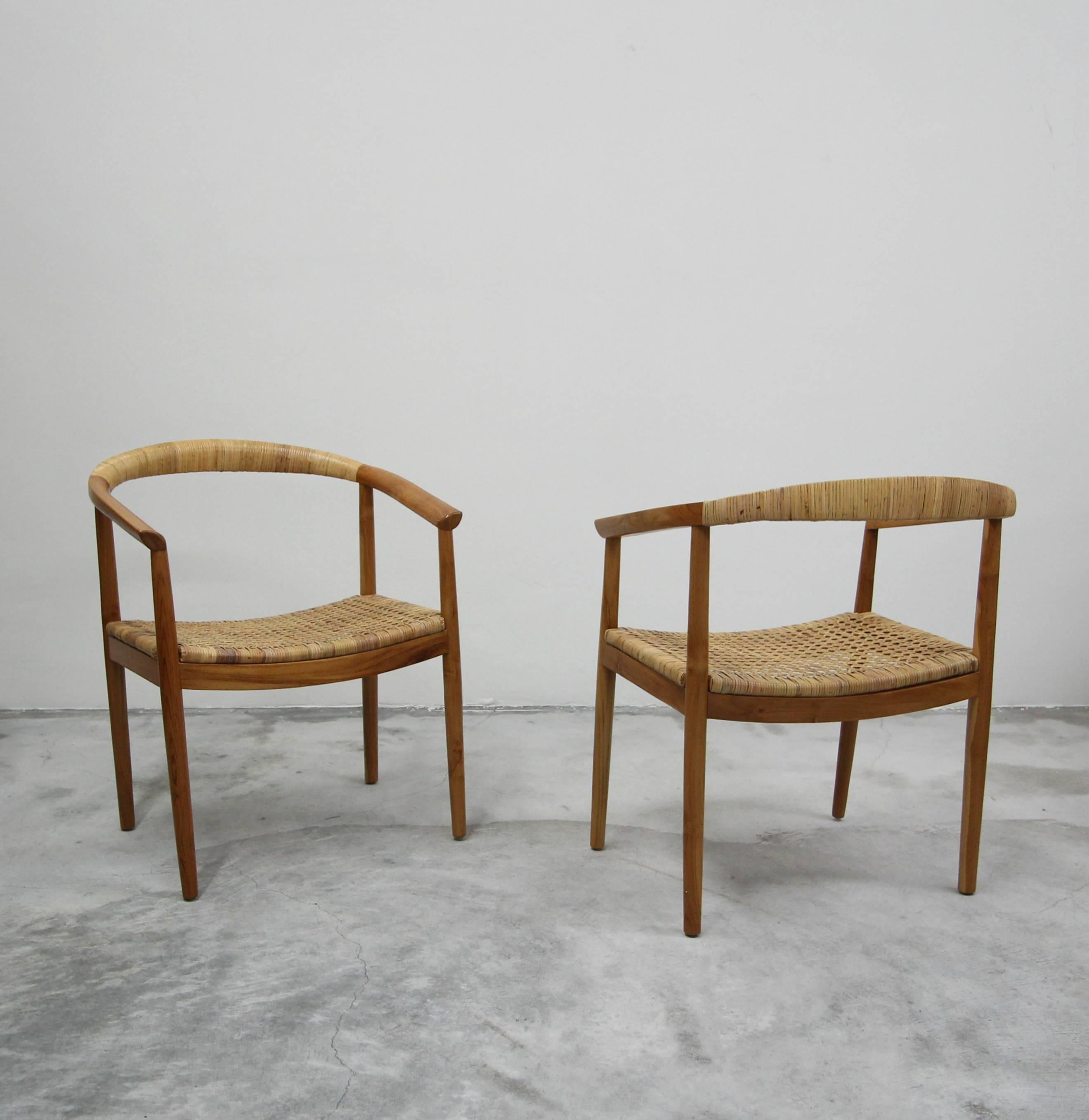 Absolutely fabulous pair of teak and cane side chairs. These chairs are large but so minimalistic. They would truly made the perfect pair of side chairs in any living space. So petite in construction they almost disappear, but nothing short of great