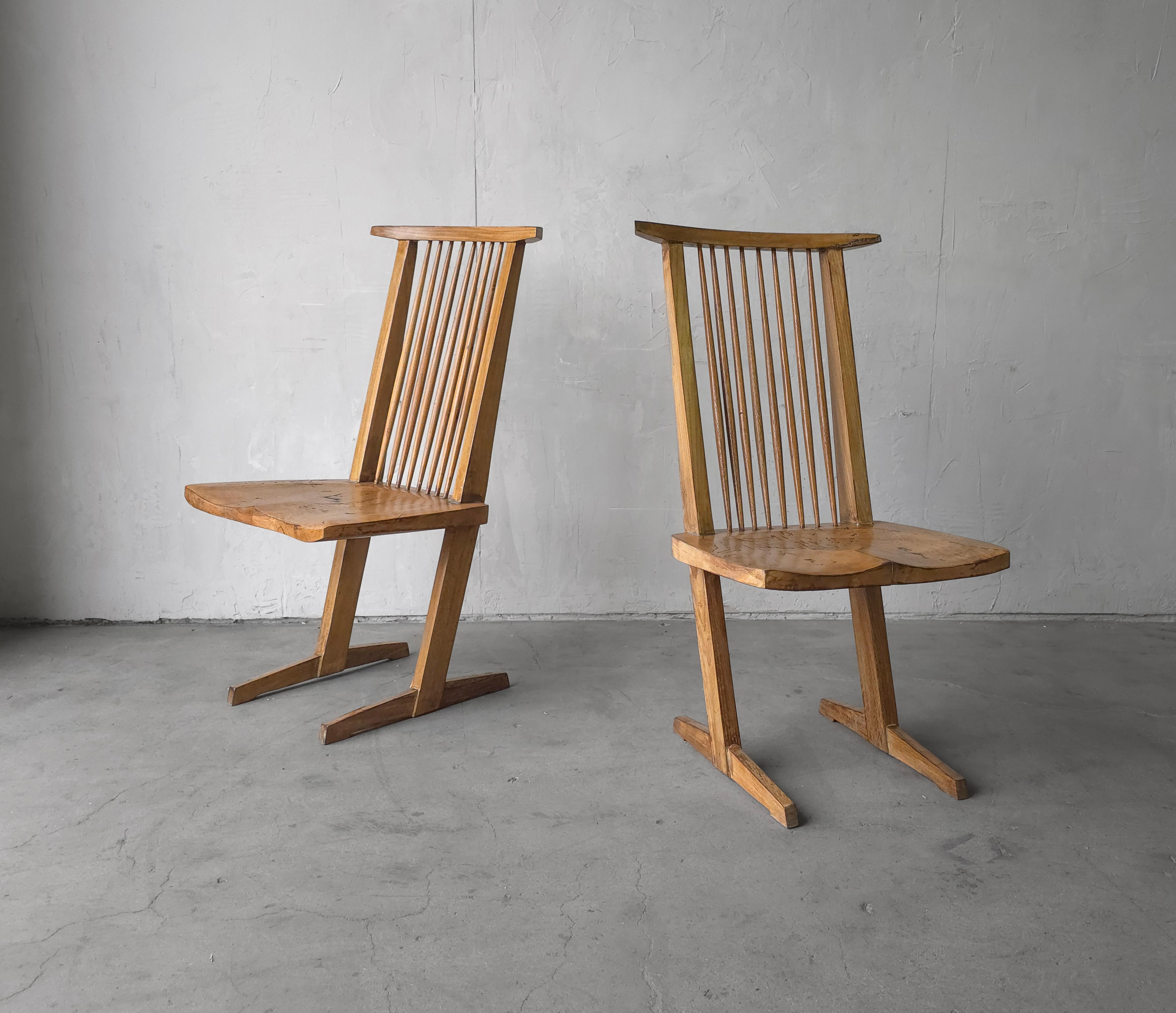 Wonderfully made pair of cantilever Conoid style chairs after George Nakashima.   These chairs are large scale and could be used as a pair of side chairs. as 2 captains chairs at a dining table or singularly as a desk or corner chair.

These chairs
