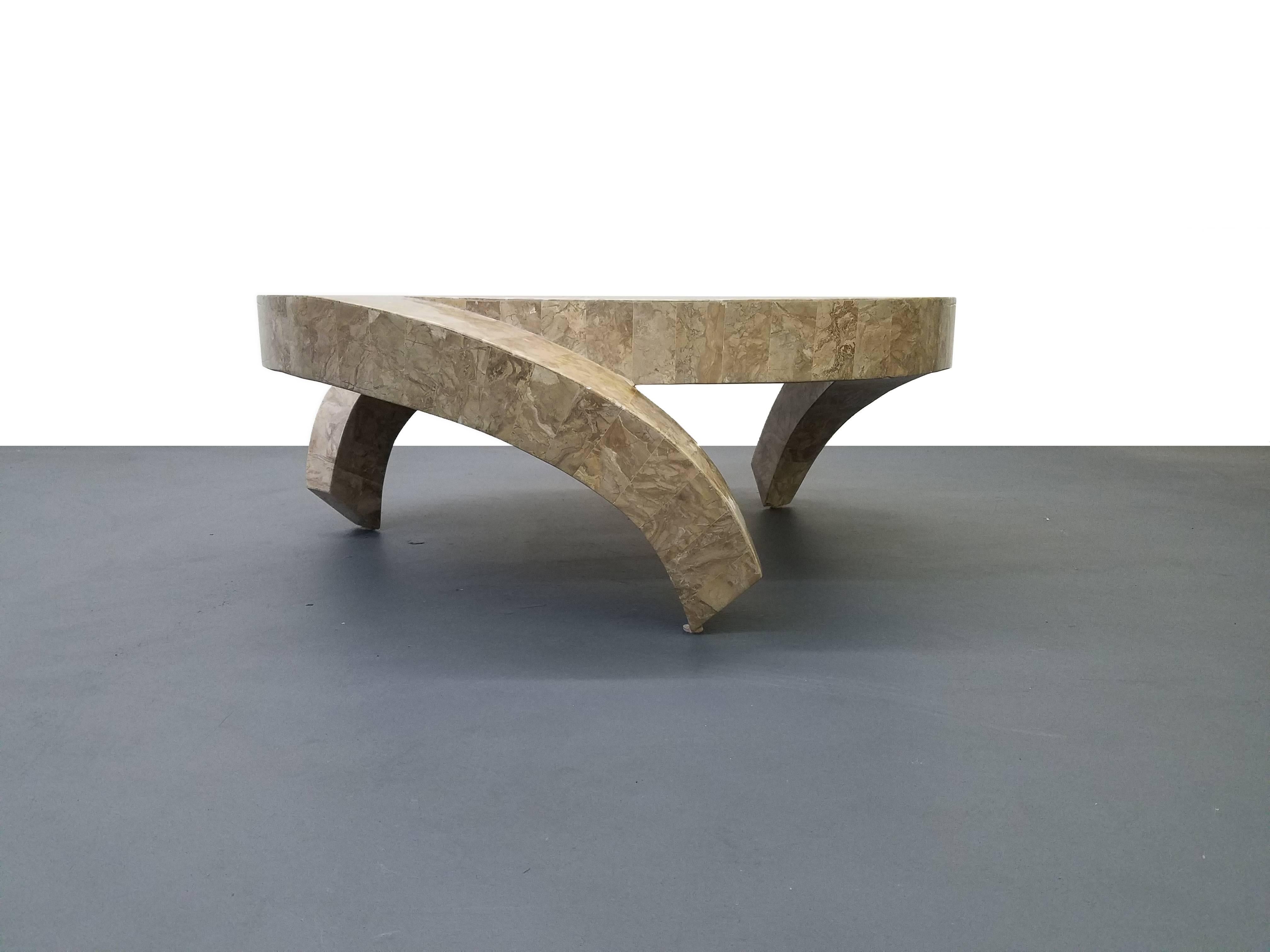 Unique tessellated stone coffee table by Maitland Smith. Table has a very eye-catching shape, with three waterfall legs. Very designer, you'll likely never see another like it.