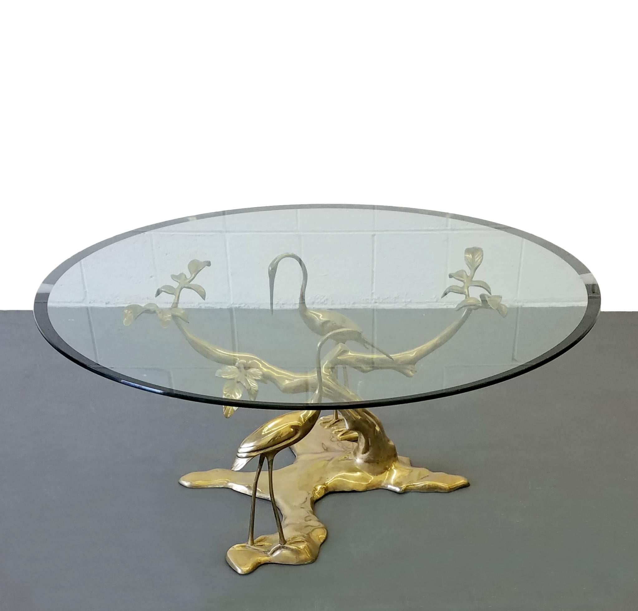 Beautiful solid brass table by Willy Daro. Tree and crane theme. Great centerpiece with lovely light patina.

Base measures: 28 wide x 22 deep x 16 high.