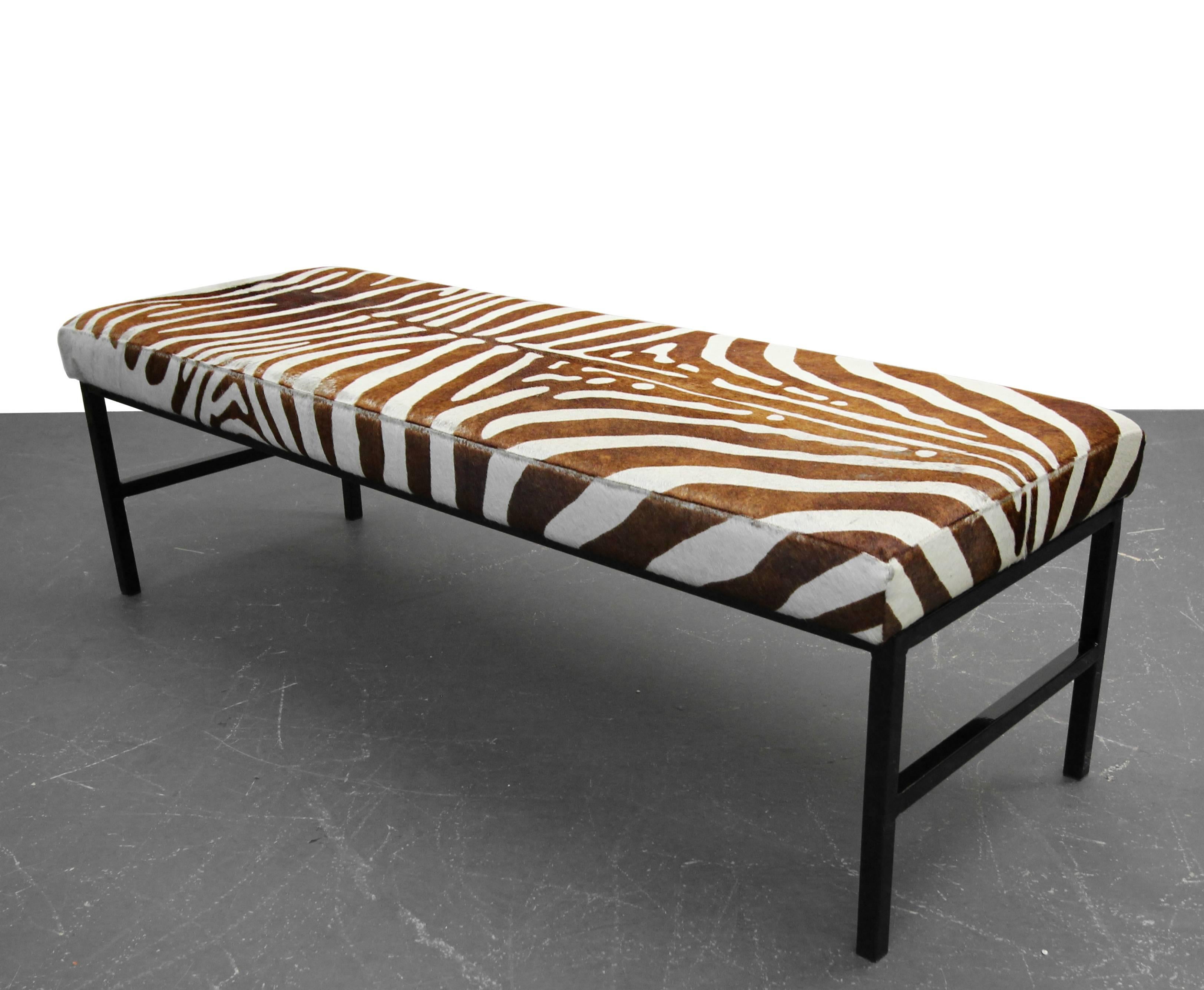 Upholstered in an authentic and rare brown zebra hide and resting upon a high gloss, powder coated base, this bench is a Minimalist punch of modern style. Looking for that one amazing detail piece to complete y our room, here it is.

Overall