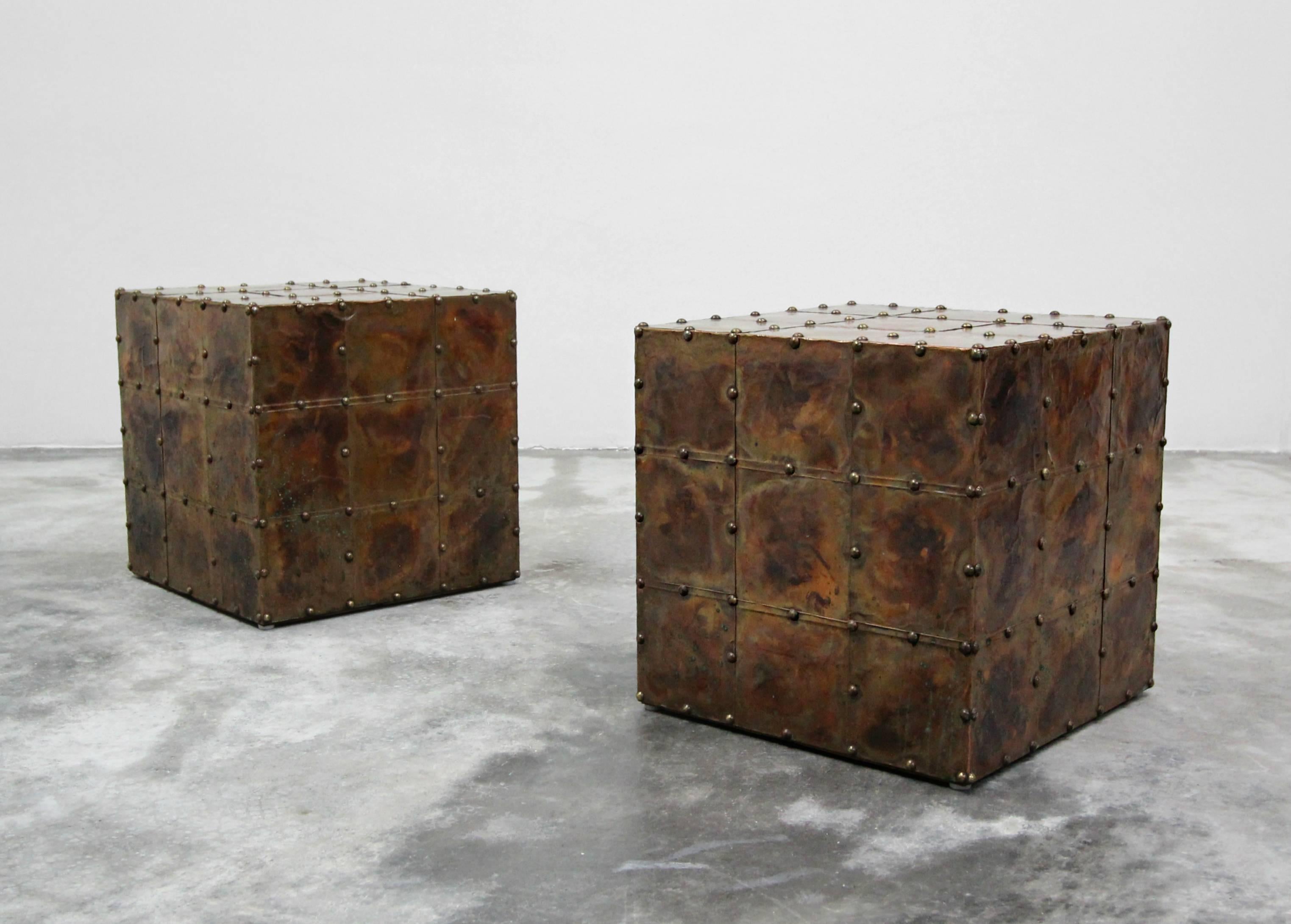 Patina is the word. Beautifully patinated pair of copper cube tables. Excellent condition with perfect age appropriate patina.  Made in Spain by Sarreid.