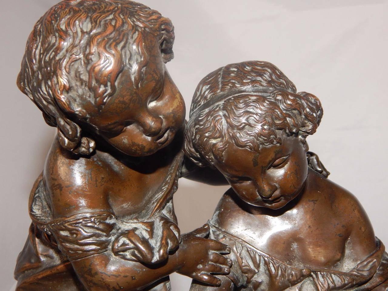 A beautiful 19th century bronze sculpture of two children
conversing while reading a book.
 Signed by Alexandre Schoenewerk.
 