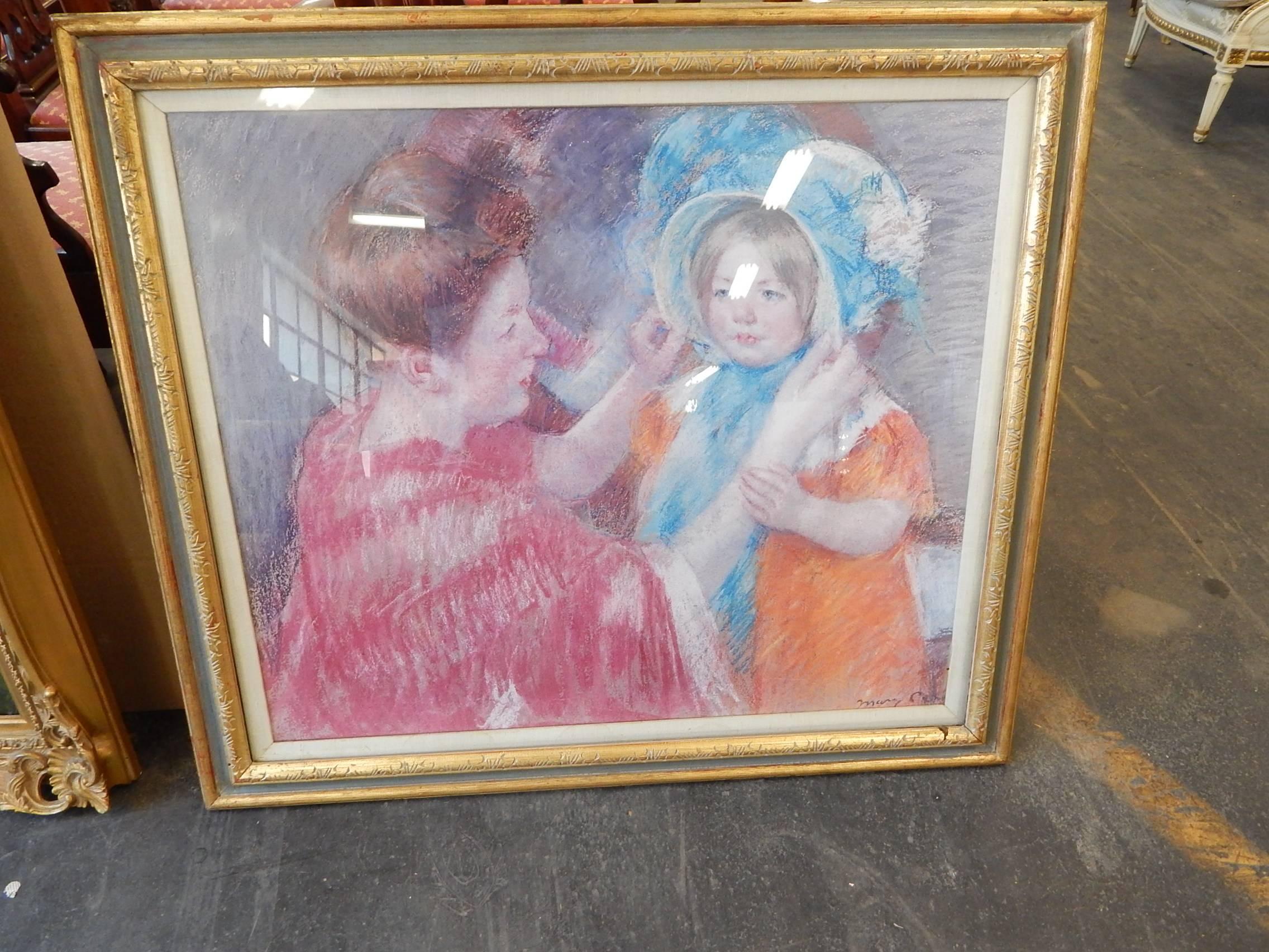 A lovely lithograph under glass depicting a mother and child, originally
painted by Mary Cassatt.