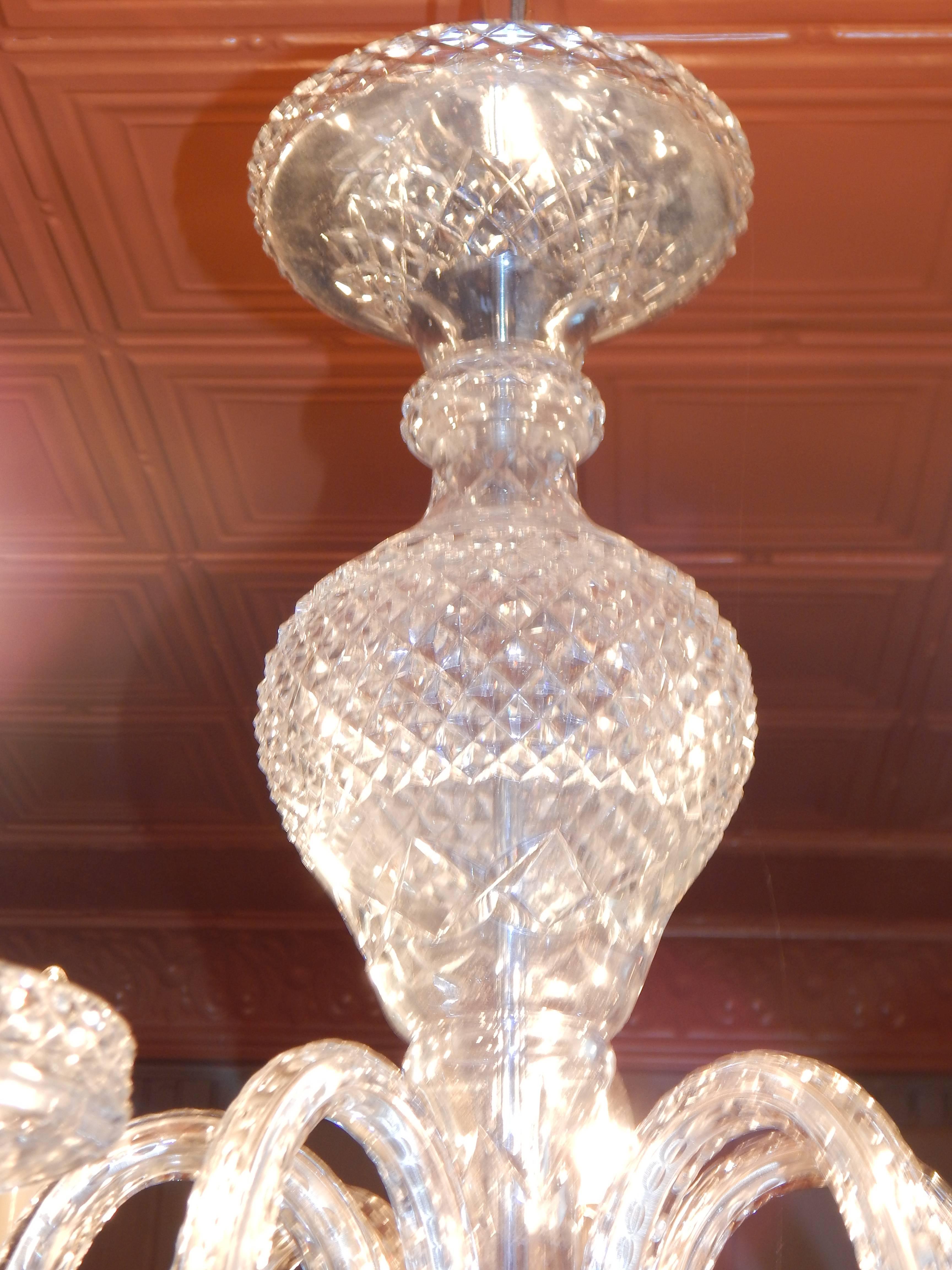 A simple, elegant Waterford style six arm chandelier.