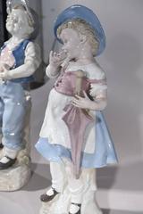 Pair of Porcelain Figures of Boy and Girl