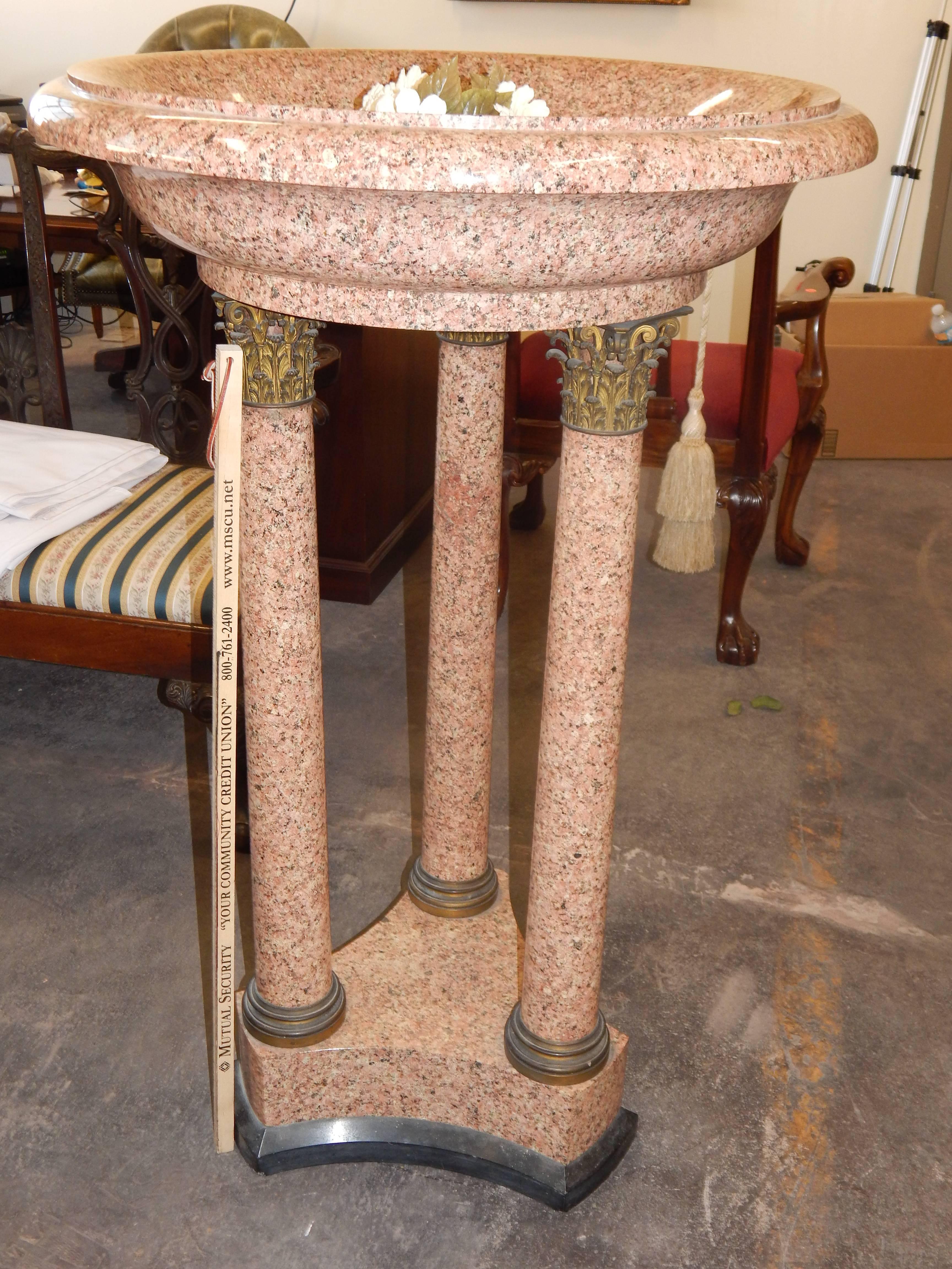 A magnificent massive, rare free standing Empire style granite font,or bird bath, with excellent quality bronze capitals over columns. This huge and impressive font, or bird bath, is made of solid granite, and is extremely heavy, and comes with a