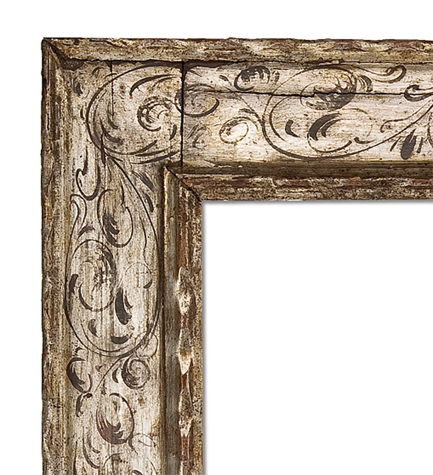 Hand-carved and gilt mirror in the 18th Century Spanish style. Silver tone in white gold with painted stencil pattern. 28