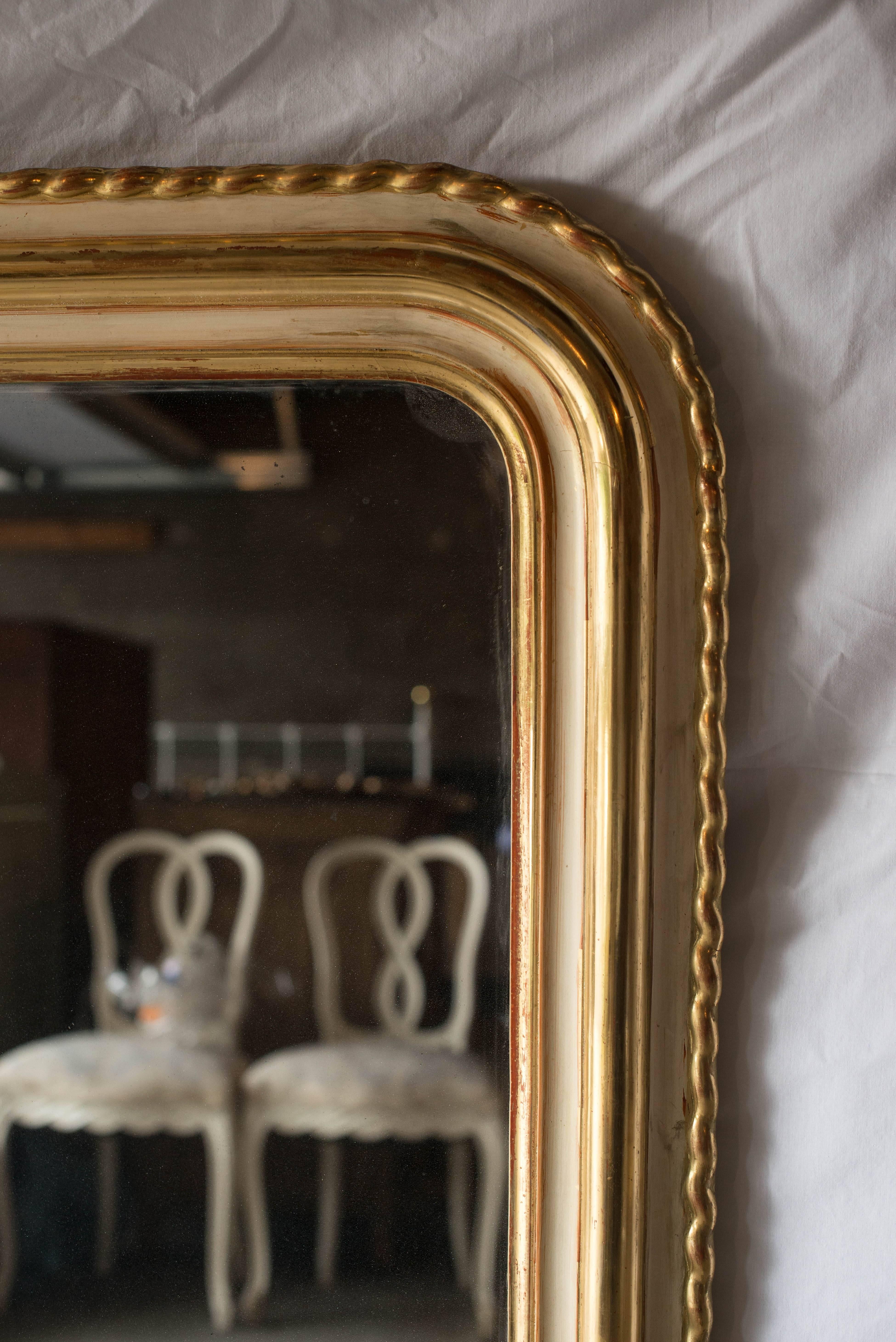 This Louis Philippe Pie crust mirror has an incredible painted finish with cream, terracotta and gilt accents.