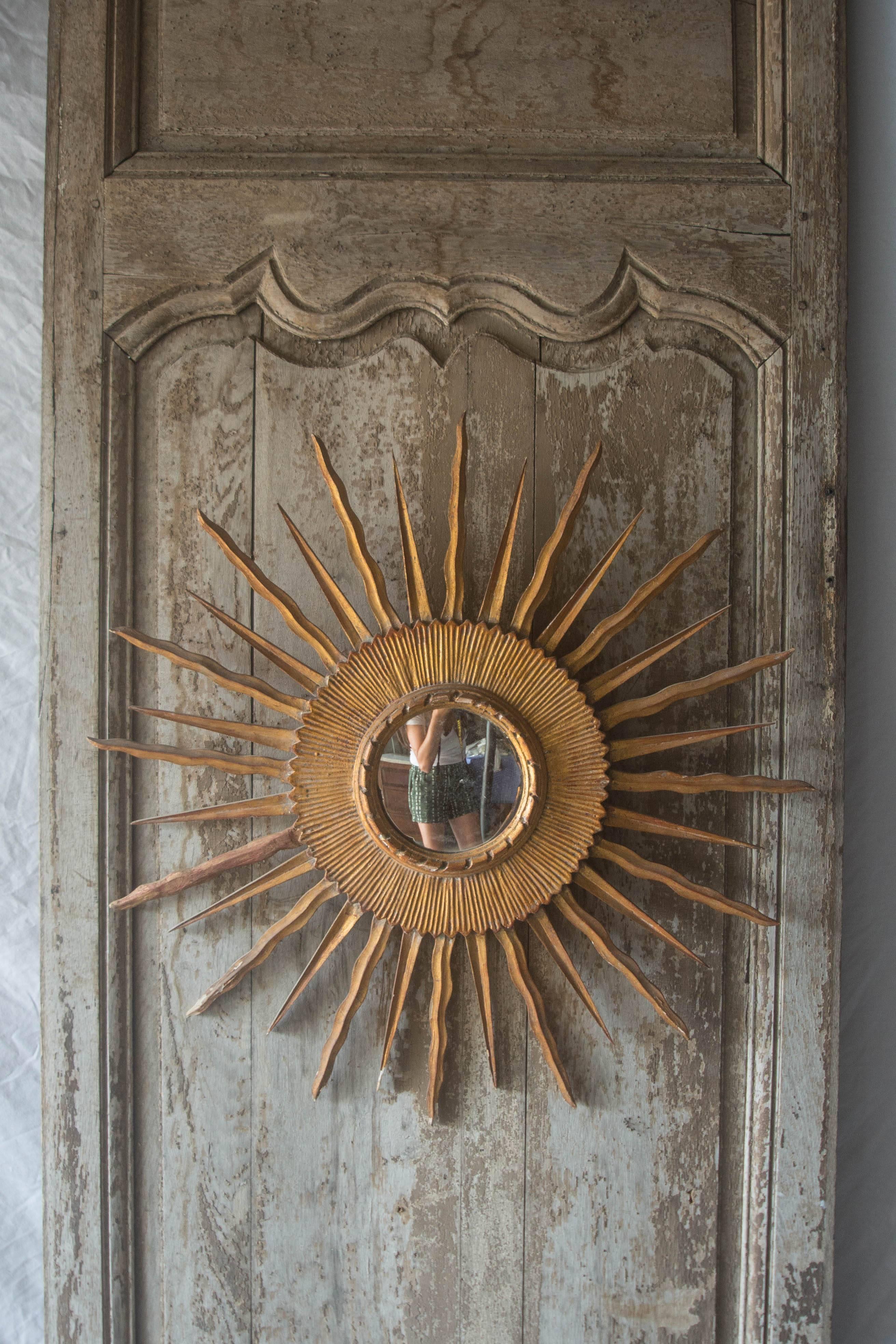 This 18th century French panel or door features an unusual raised panel with the 