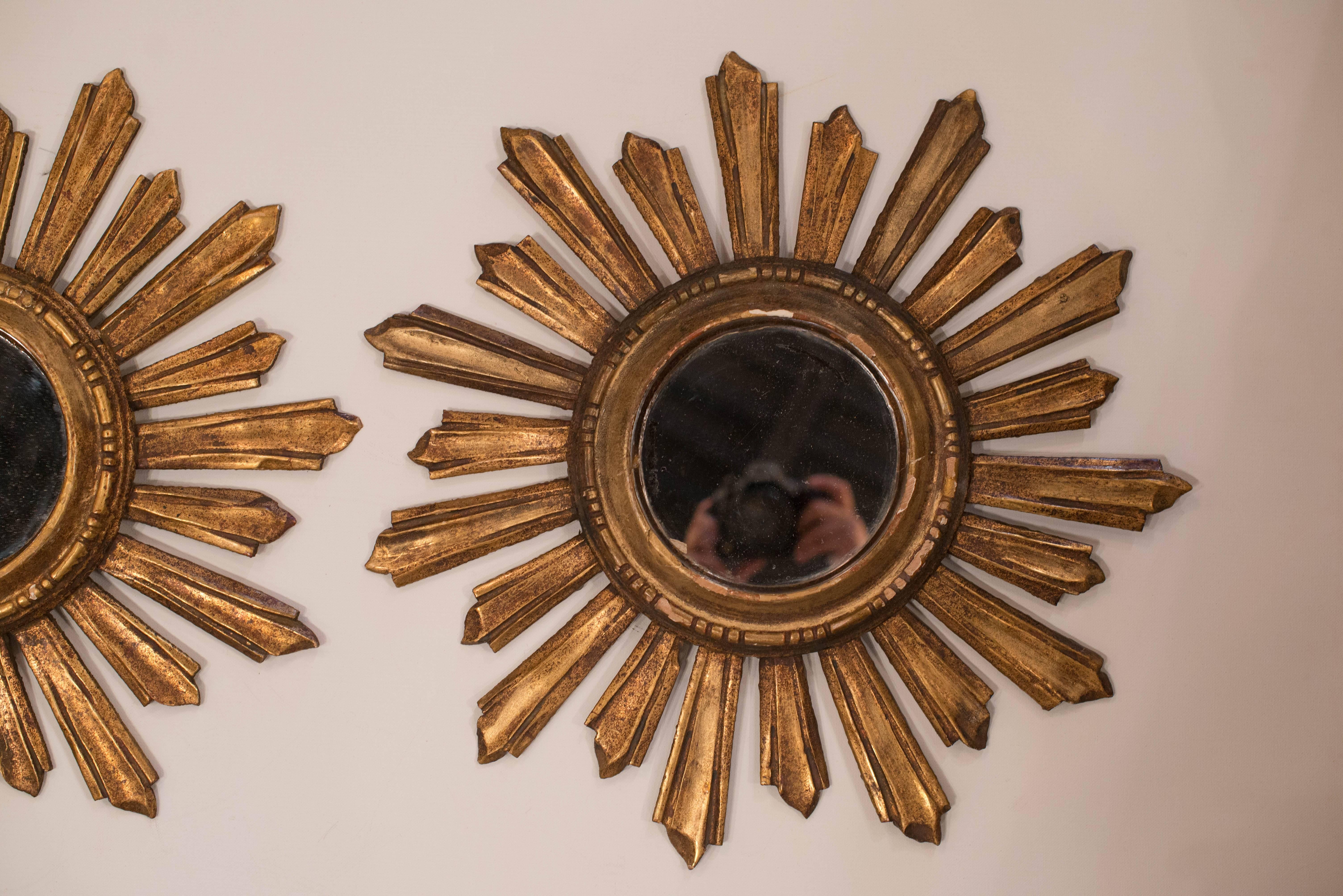 Pair of Italian giltwood sunburst mirrors.