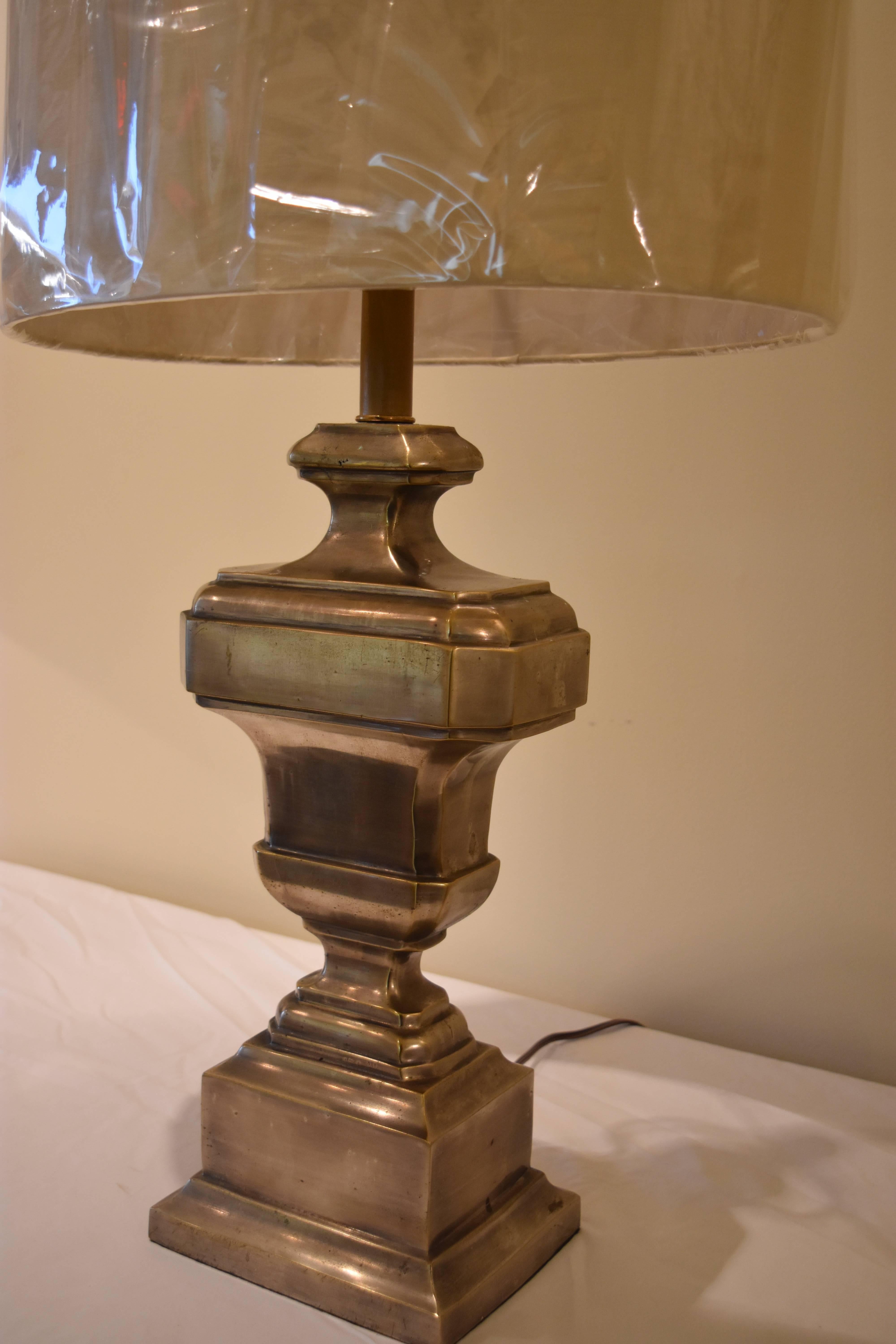 This vintage silvered bronze lamp from Paris has an urn shaped base and has been newly rewired for American use. The finish is a lovely warm silver and comes with this linen oval drum shaped shade.

Measurements with shade:
Shade width 16 inches