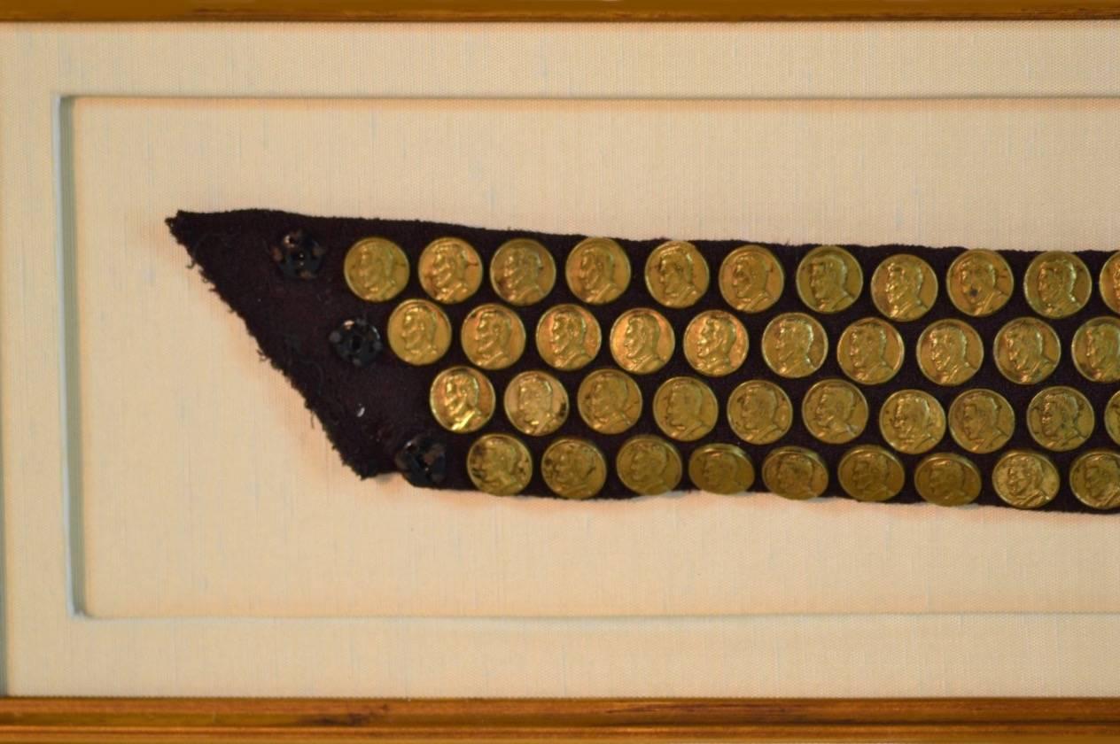 Abraham Lincoln remembrance funeral buttons hand sewn onto Mourning Sash, 1865.

A unique collection of 140 scarce brass President Lincoln funeral mourning buttons. Each button is detailed with President Lincoln’s image, all of which were hand sewn