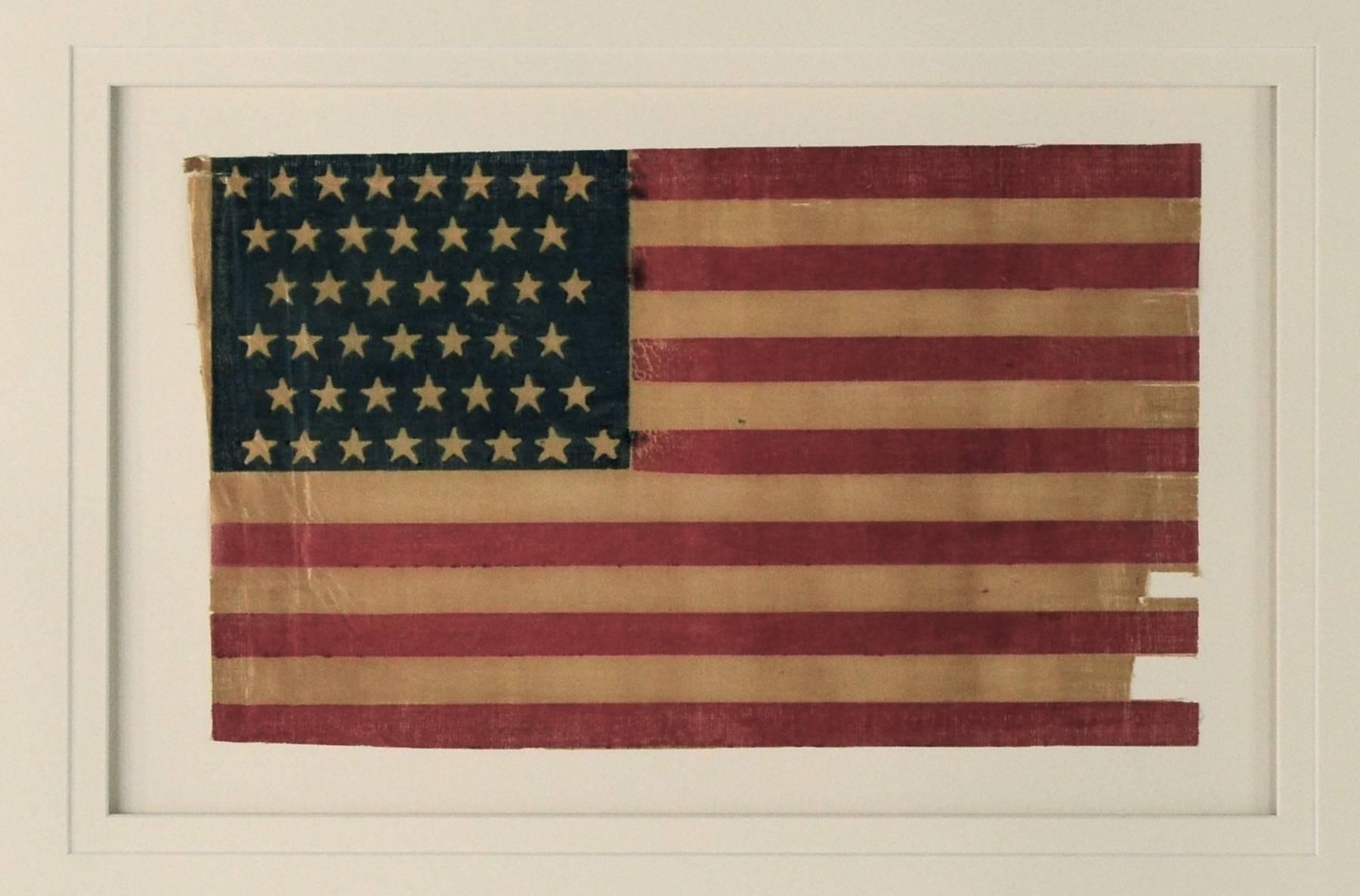 Authentic antique 44 star flag, circa 1890. Made of starched glazed gauze fabric.
Conservation framing with UV acrylic. 44 Star Flags are fairly rare.
 