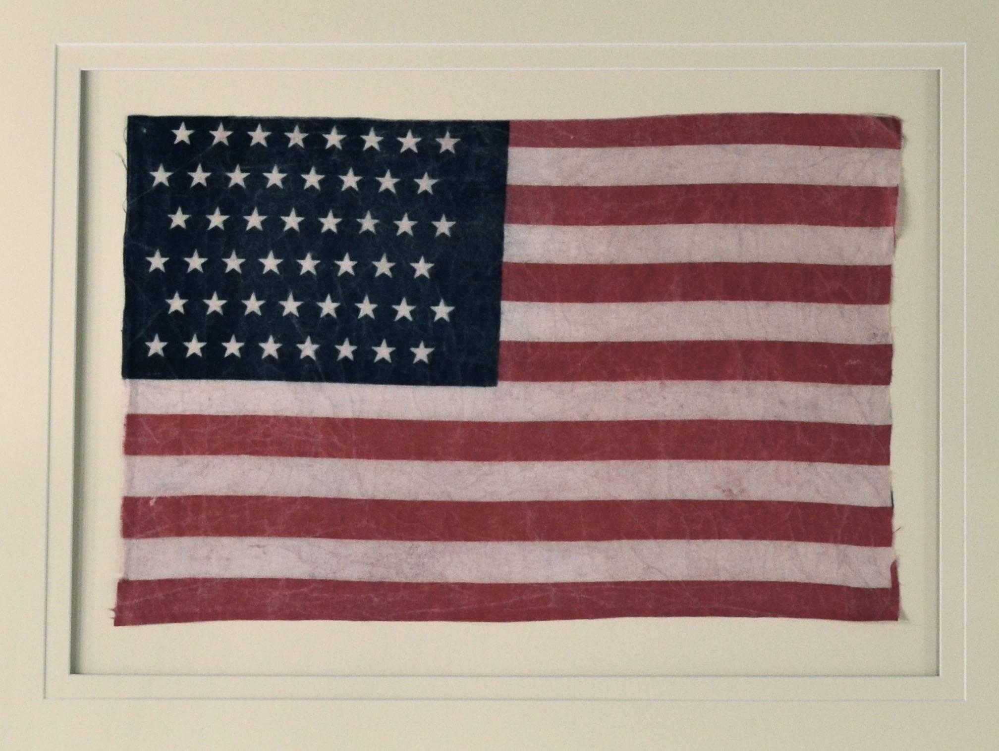 Authentic antique 48 Star flag. This particular star arrangement was only used for two years from 1912-1914 due to an executive order issued by President Taft to regulate the design and proportions to the American Flag. Made of printed