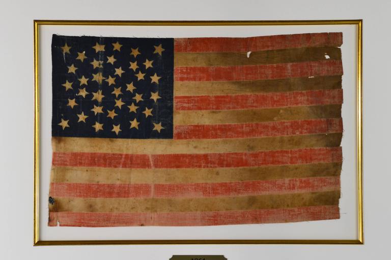 Authentic antique 36 star flag. This flag would be considered a parade flag of the day and would have been attached to a wood stick. The flag is made of a starched cotton fabric and has a exceedingly rare star arrangement. One part of collecting