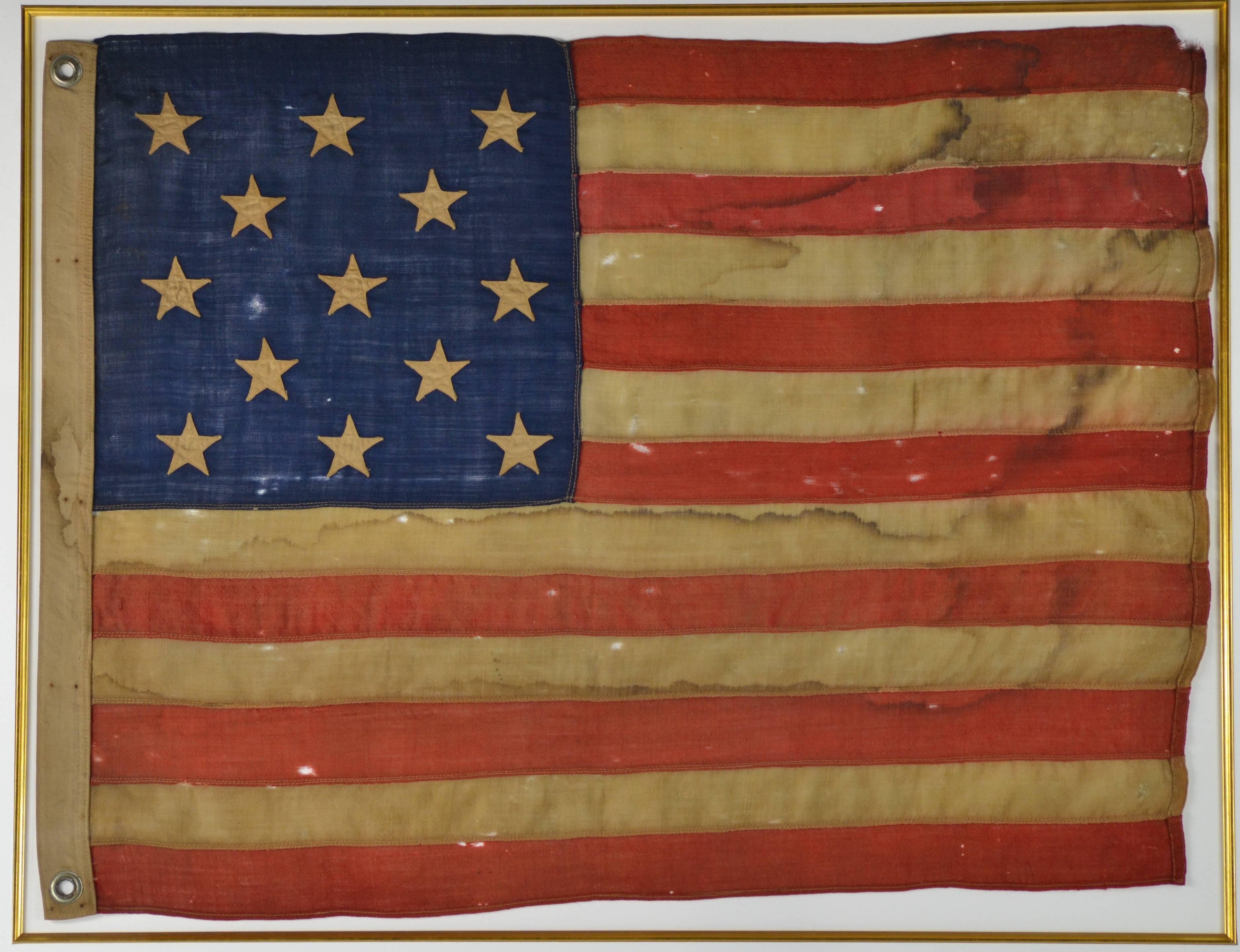 Gorgeous authentic antique 13 Star Flag. The color is incredible, its like its producing a golden glow. The flag is hand treadle sewn, made of wool individual treadle sewn and the canton is a wool. The stars are meticulously sewn and are quite
