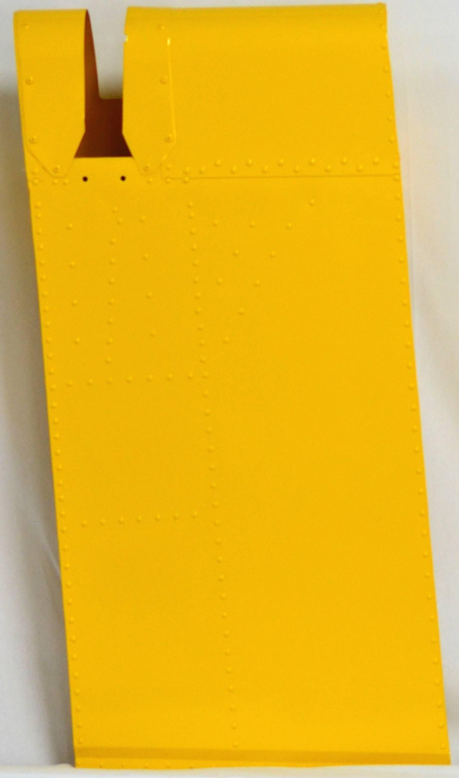 Modern Wall Art? A rare section cut from a authentic WWII DC-9 wing tab. It has been cleaned and painted professionally with high gloss yellow powder coat paint.
Its 17" wide, 34" high and 9" deep. Just needs a hanger on the back to