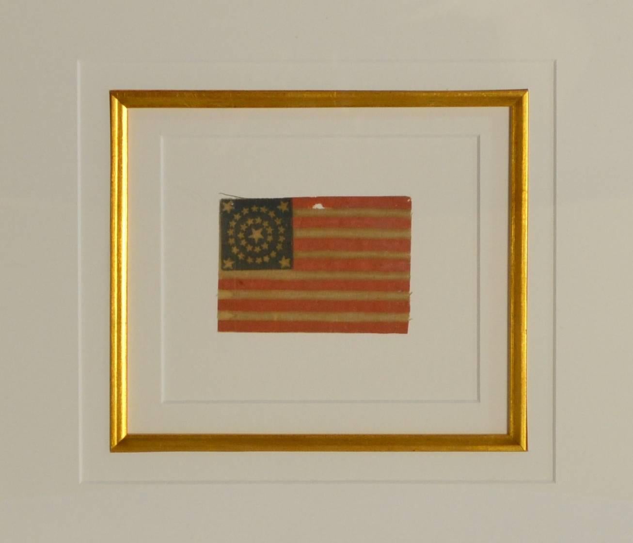 Very rare antique flag with 34 stars arranged in a rare pattern called a double wreath with large center star to symbolize the entry of the new State into the Union in 1861. 34 Stars makes this a rare civil war flag. Made of starched gauze