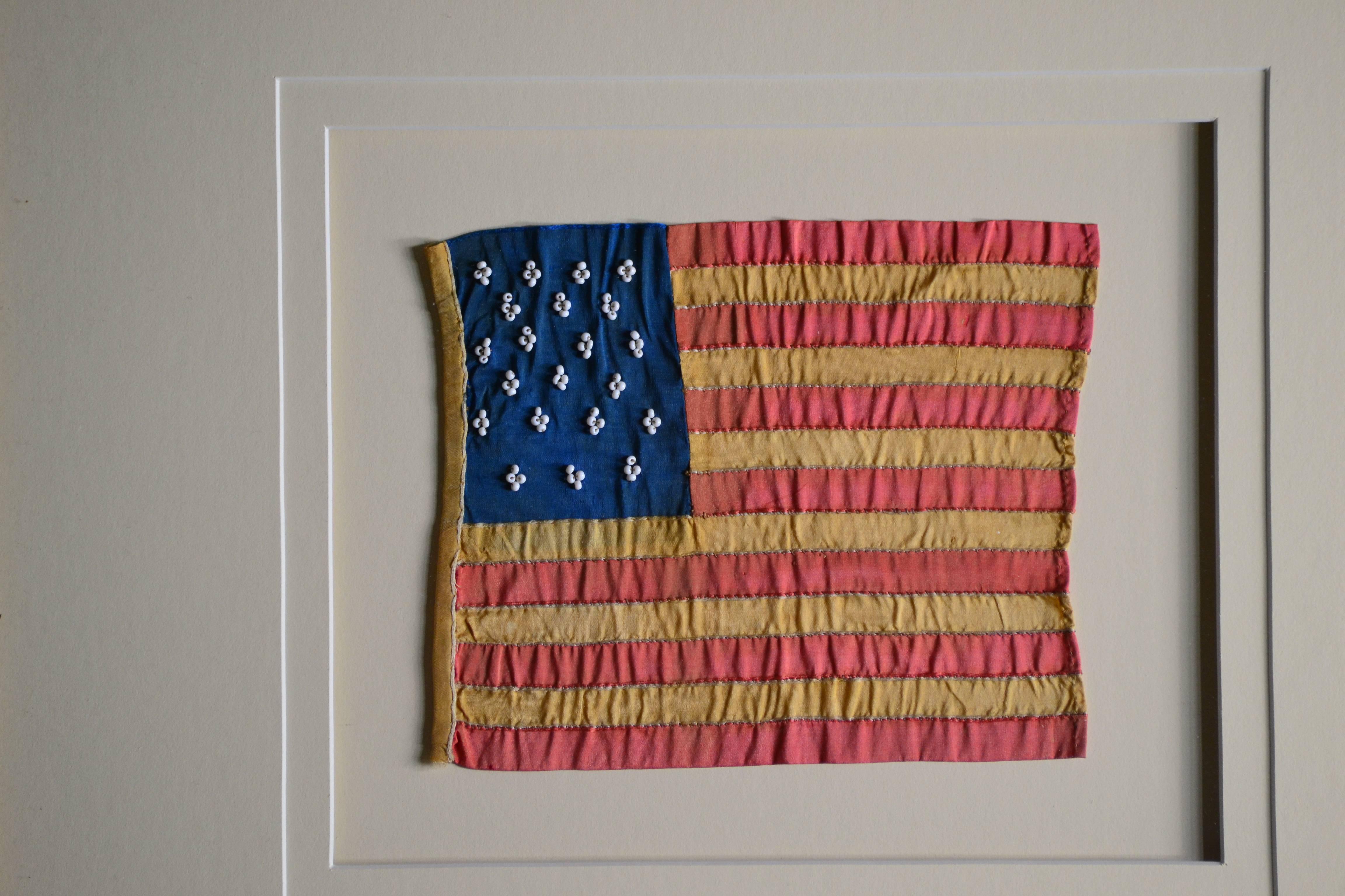 Incredible handmade 21 star flag. The flag is made of silk. Individual hand cut and hand sewn stripes to a fine blue silk canton. Each of the 21 stars is made of four very tiny glass beads hand stitched on with meticulous precision. The hoist side