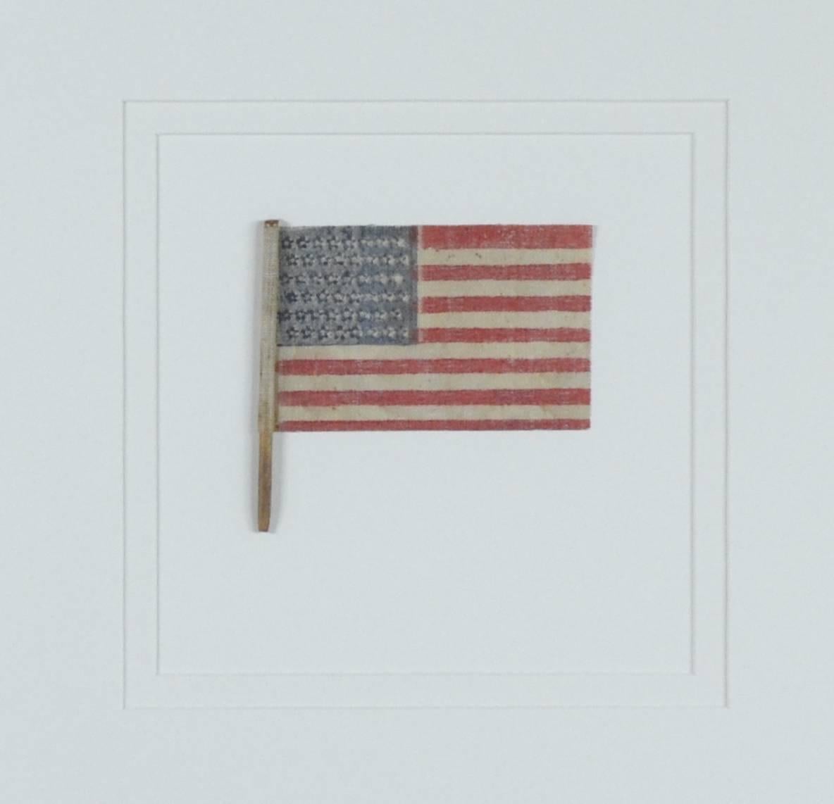 Antique 48 star flag 1912-1914. This star arrangement was only used for two years. Starched gauze fabric.
Museum framing with UV acrylic
#10672c
Historical Americana.