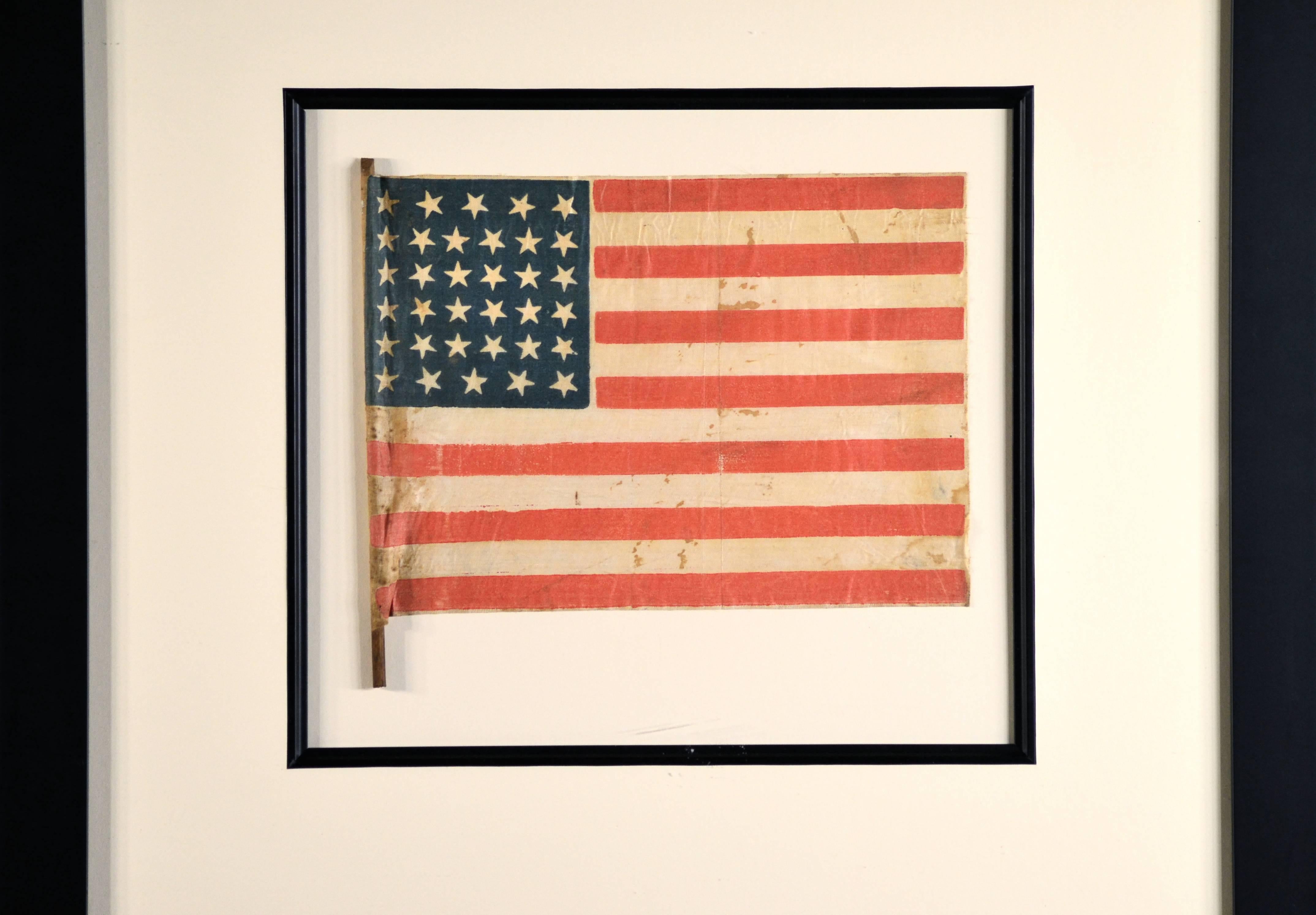 Authentic antique 34 star flag, civil war, circa 1861. Very rare star pattern: the first vertical row the stars is straight. The second and fourth vertical rows the stars curve in to the middle with two shorter vertical rows of stars in the centre.