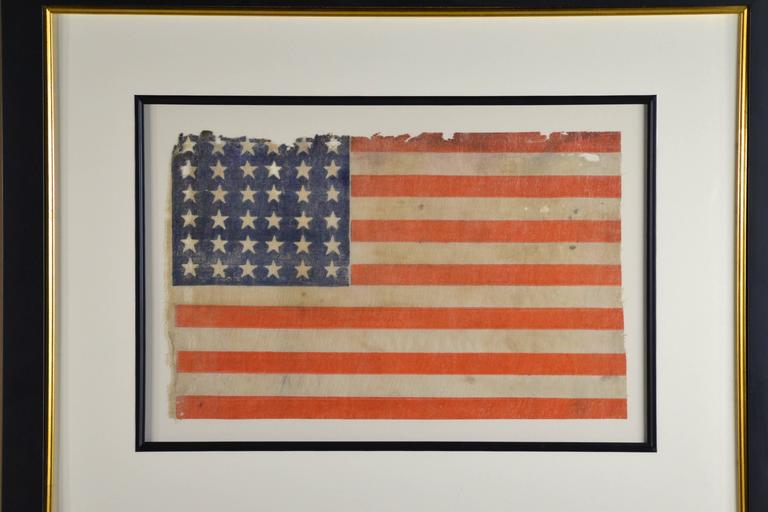 Authentic antique 36 star civil war flag, circa 1864. Abraham Lincoln was president when this flag was made and used. Made of starched linen. The red has turned to a wonderful chromatic orange glow color. The flag is 11.5" x 17.5"
Museum