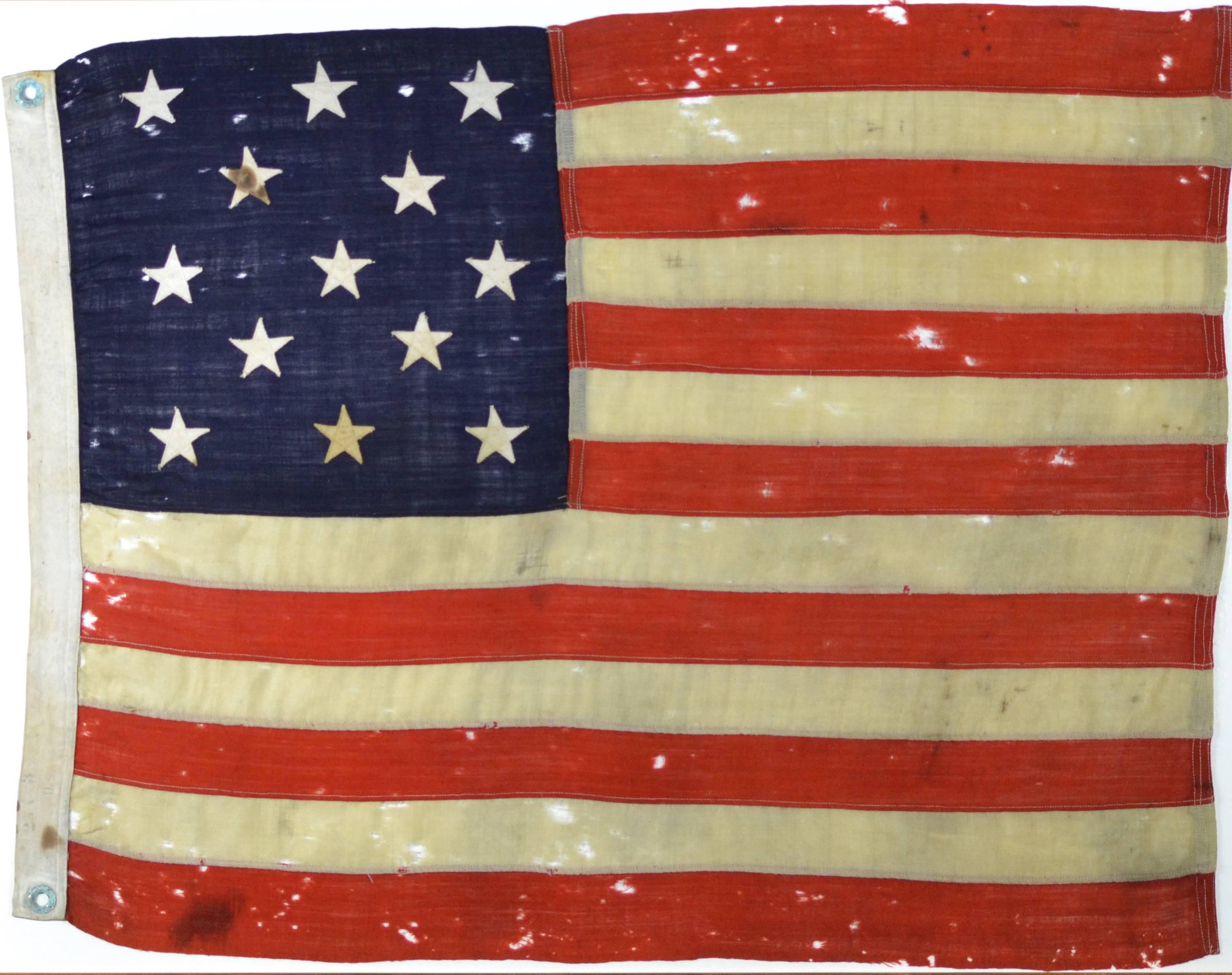 Beautiful antique 13 star American flag made of wool. The perfect size for almost any room. Single line hand or foot pump treadle sewing. Individual hand-cut and sewn stripes. Hand pressed brass grommets on a canvas hoist. Fly end is triple treadle