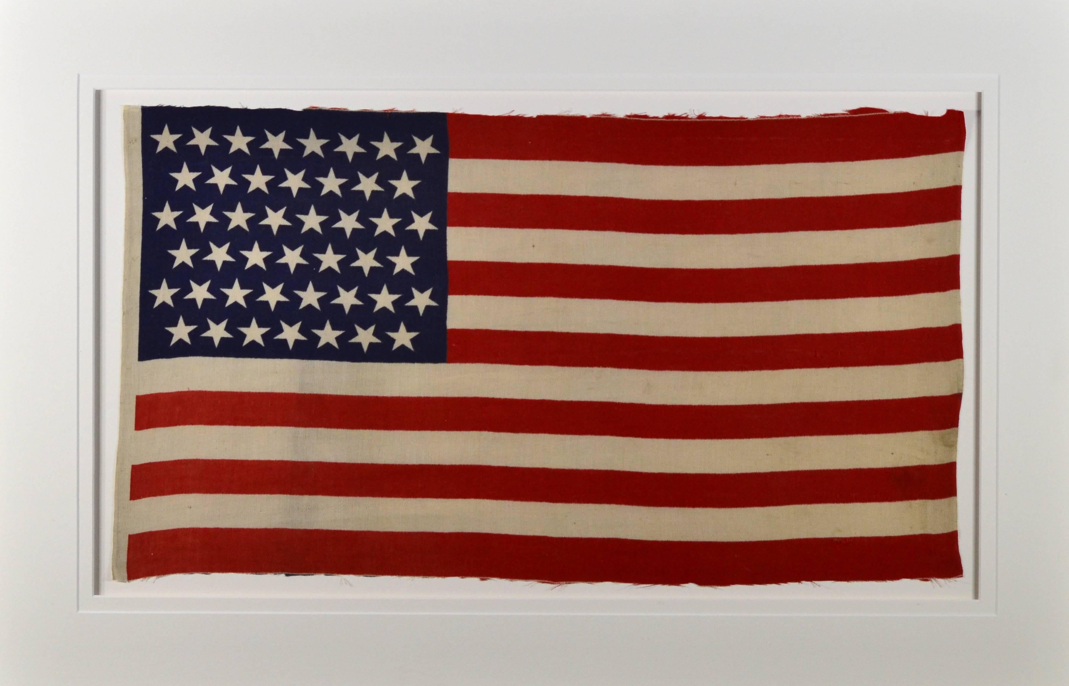 Authentic antique 45 star American flag, circa 1896. Great size for almost any room. Made of cotton fabric. Has great alternating up side down stars, circa 1896 used during the Spanish American War era.
Measure: Flag is 16" x 26"
Museum