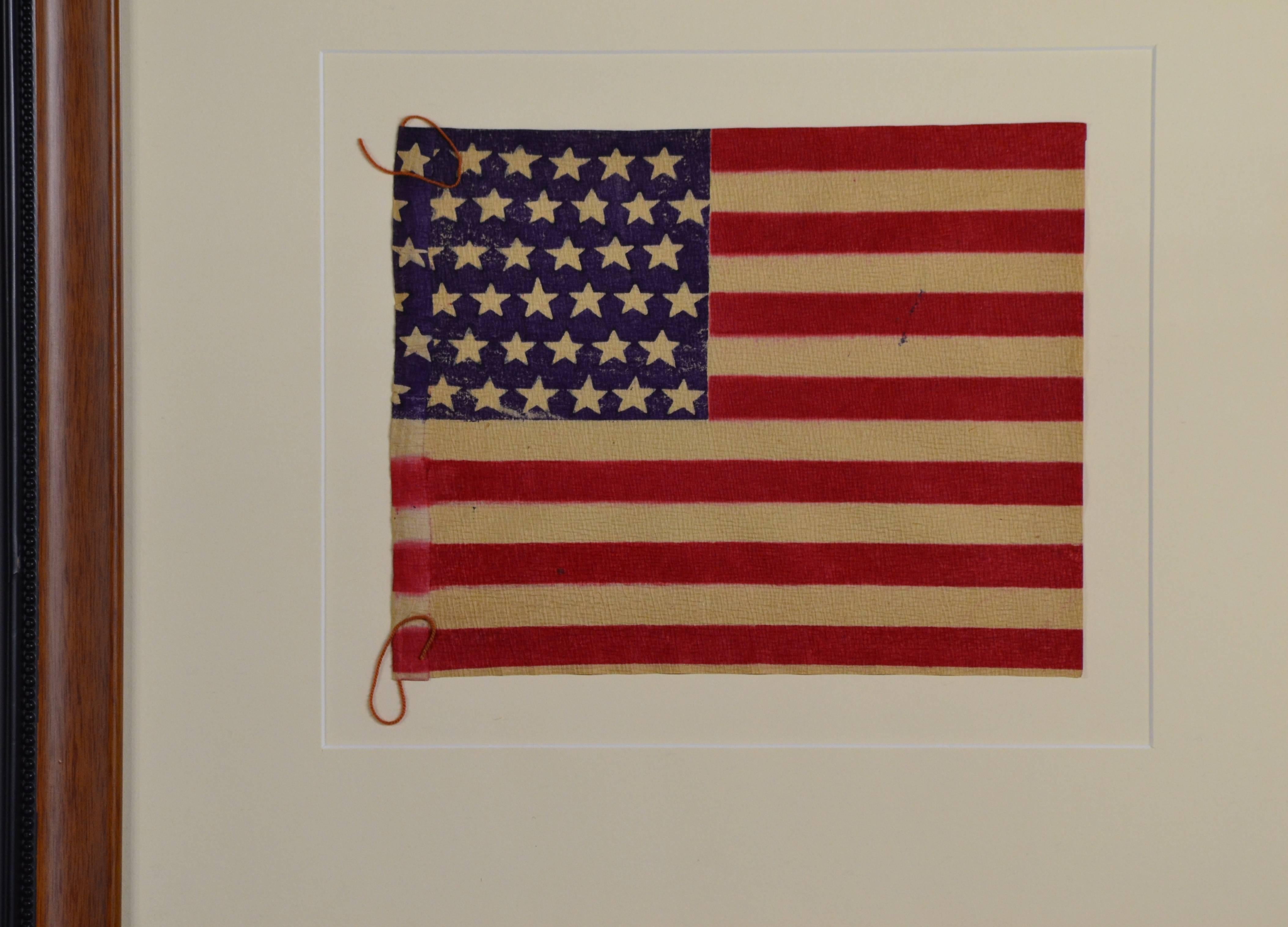 Authentic antique 42 Star flag made of paper. A flag made to celebrate the addition of the 42nd state into the Union in 1890. Flag is 7