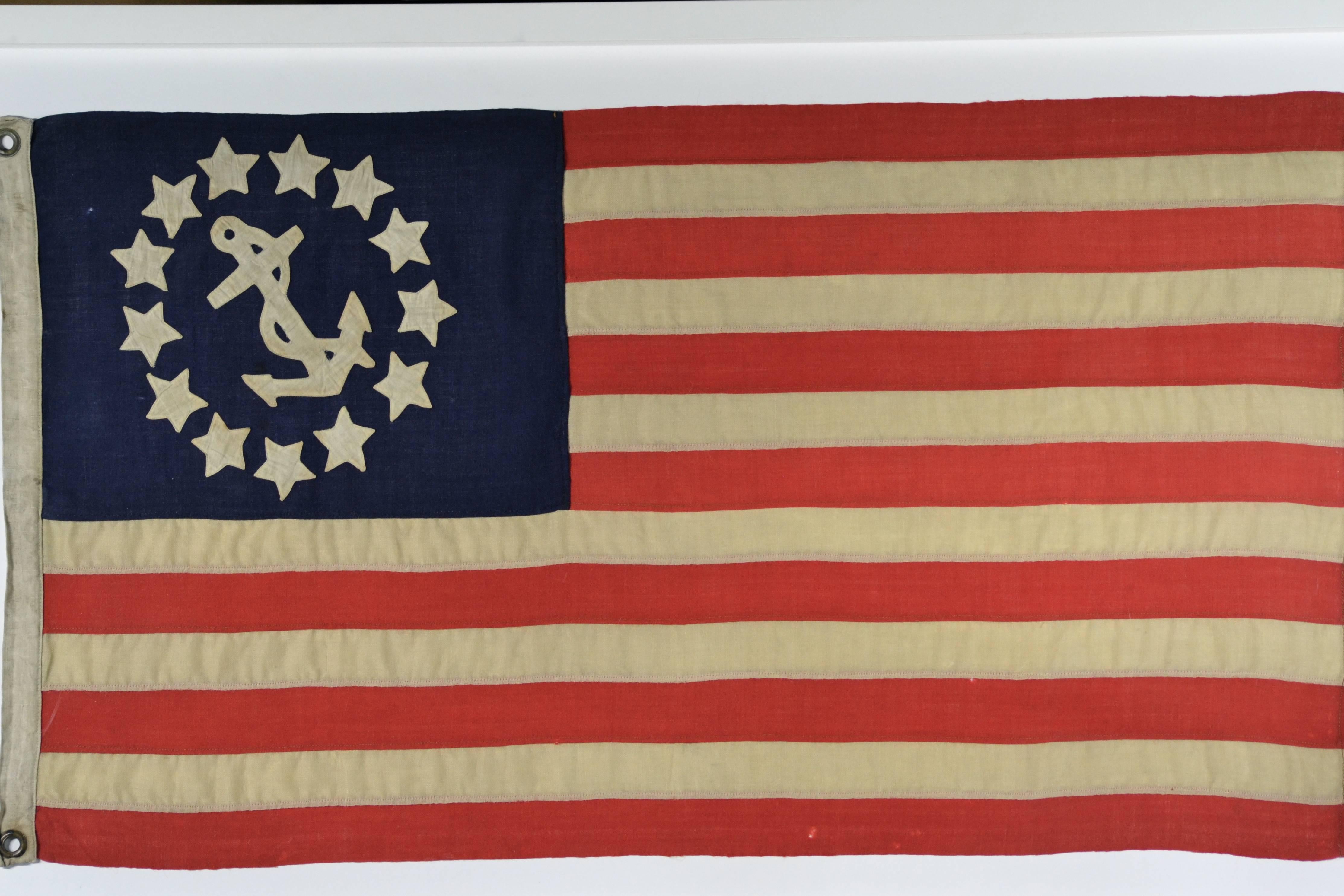 Antique boat yacht flag made of wool with hand-sewn stars. Hand cut and hand-sewn 13 linen stars and anchor. Individual cut and treadle sewn stripes. Linen hoist. Hand pressed brass grommets. Flag end is double single line treadle sewn. Flag size is