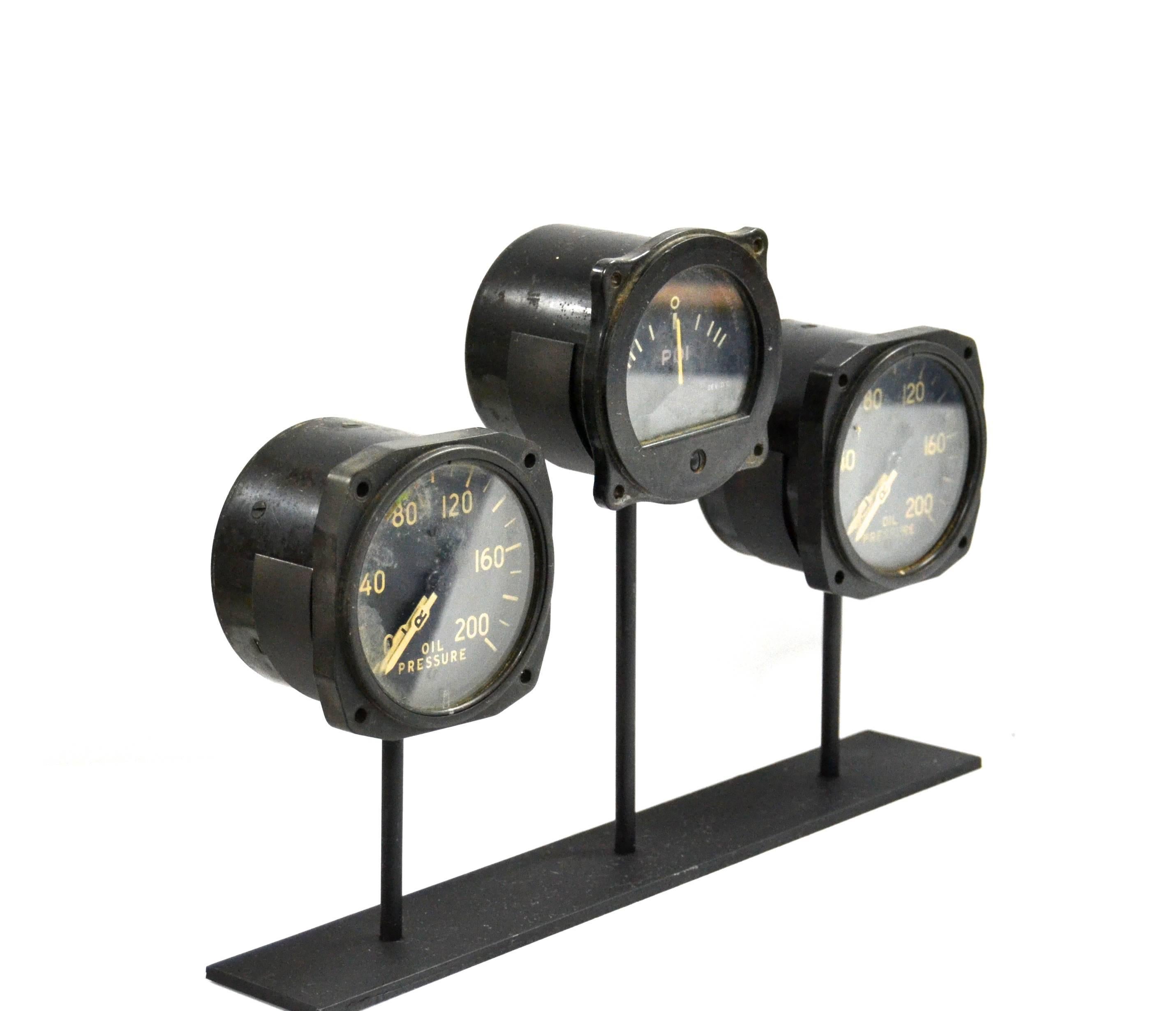 Authentic 74 year old WWII B-17 flying fortress & B-24 liberators cockpit instrument panel gauges

Three gauges on a custom-made metal museum stand. PDI gauges, (see description below)
Two very rare L R gauges (left engine, right engine) The