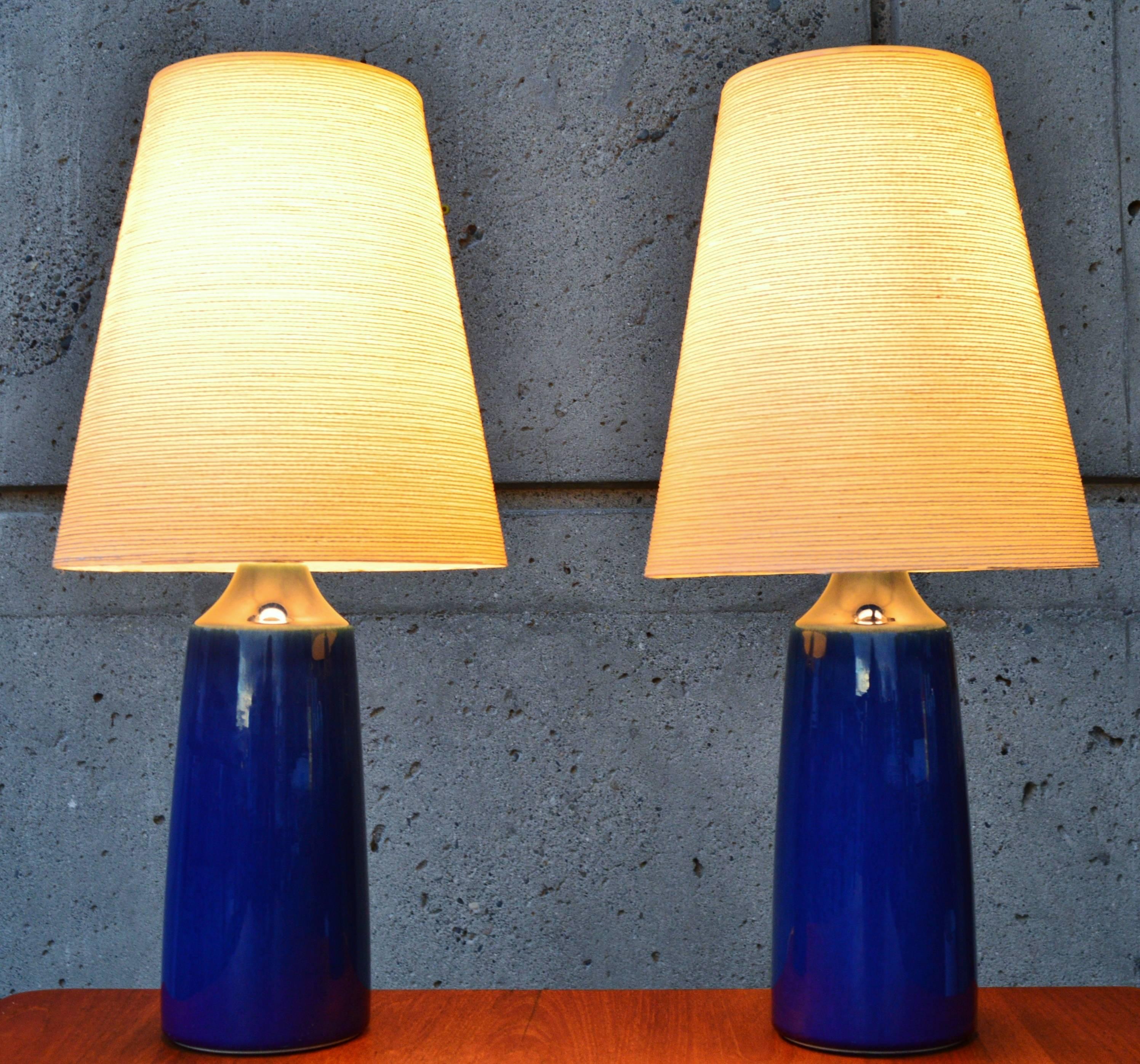 This hot pair of cobalt blue Danish Modern lamps were made by Lotte & Gunnar Bostlund. If you're not familiar with the stunning ceramic lamps designed and created by Lotte & Gunnar Bostland, originally of Denmark but who relocated their business to