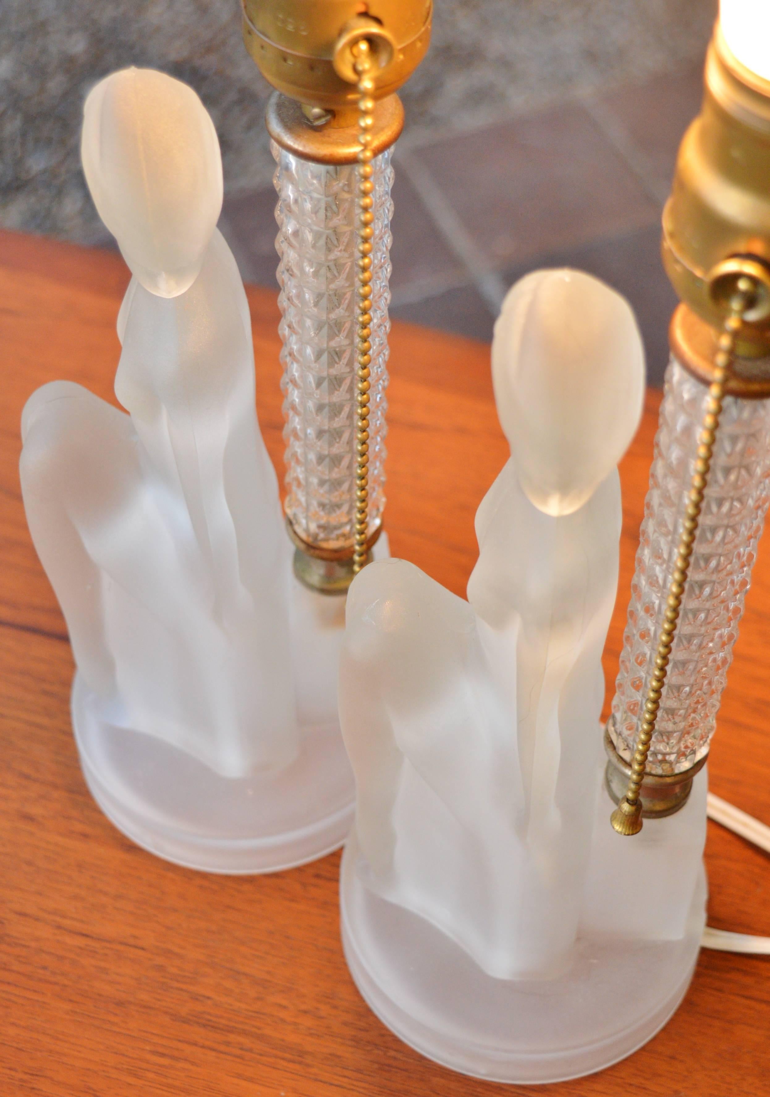 This stunning pair of Art Deco lamps with frosted glass nude figures and textured clear glass and brass stem have a really soft glow and subtle beauty.  In amazing condition for their age and so wonderful to have a pair.