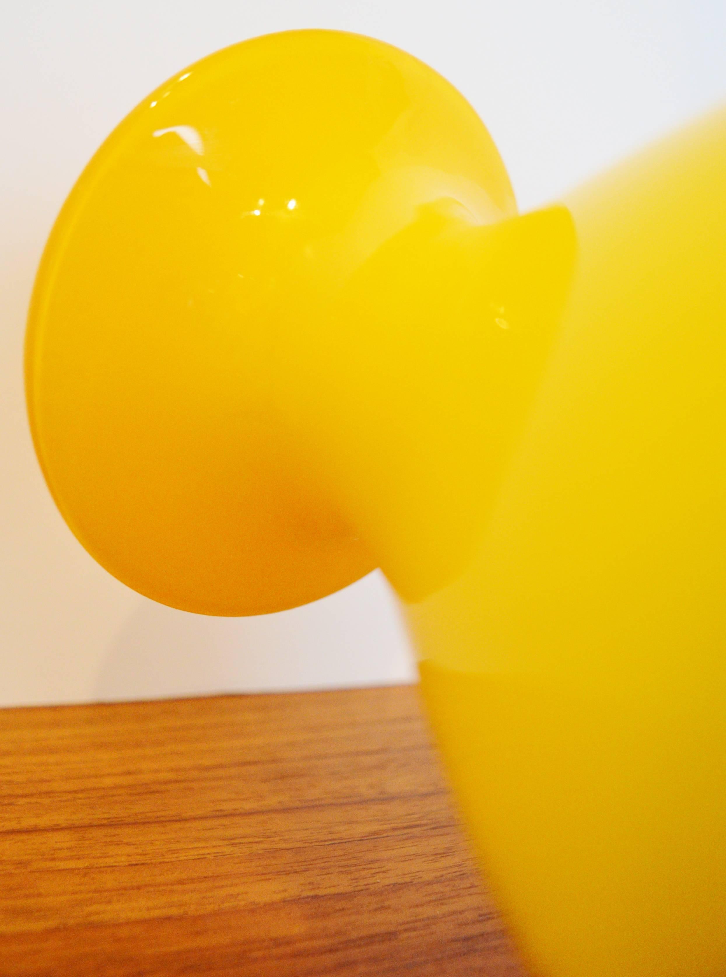A fab pop of bright yellow in this curvy handblown glass vase. Designed by Per Lutken for Holmegaard.