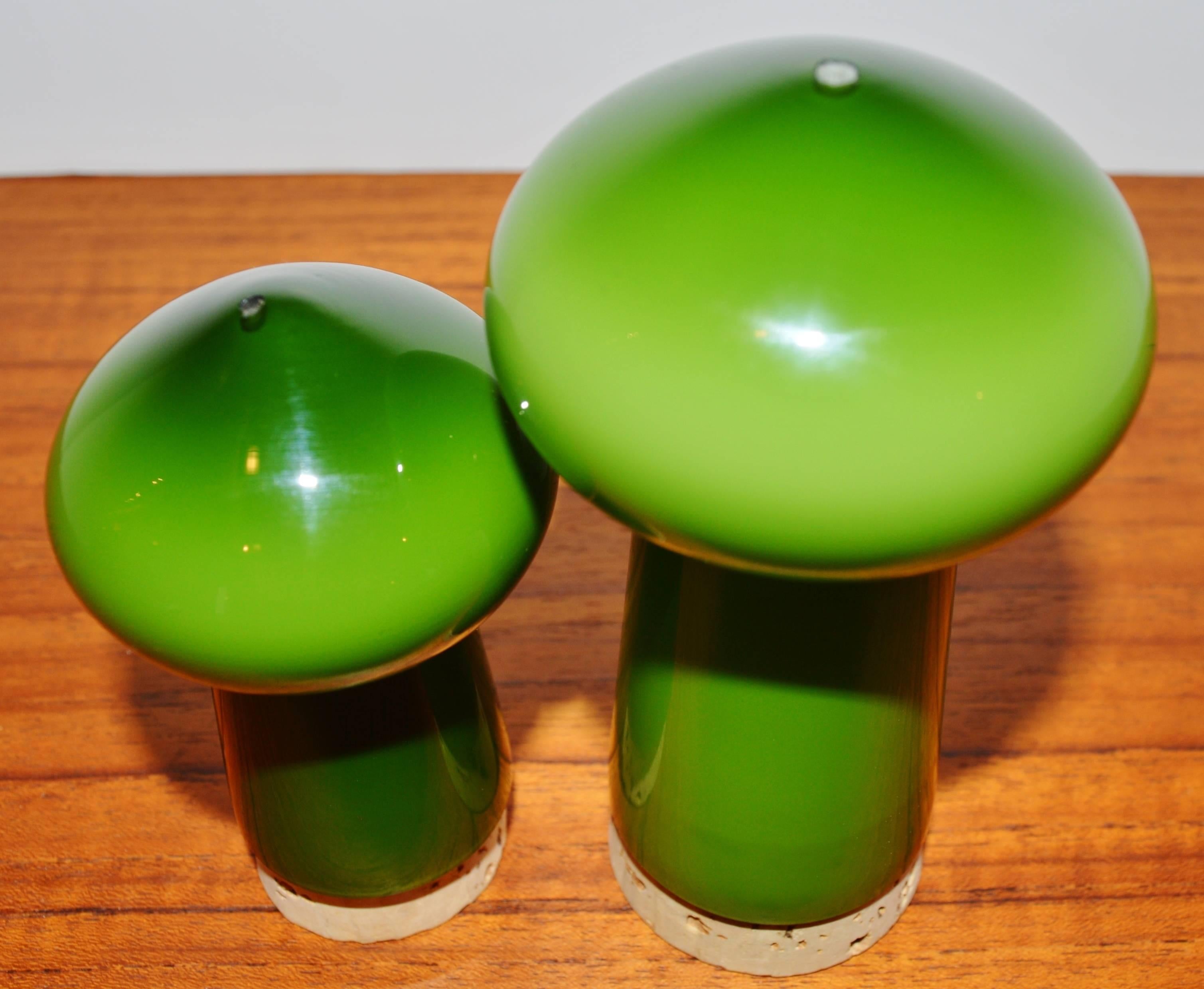 This charming pair of Michael Bang salt and pepper shakers look like they were never used! In a most delicious shade of green glass, with no chips, cracks or scratches and even the corks look new! Produced by Holmegaard. The dimensions below are for
