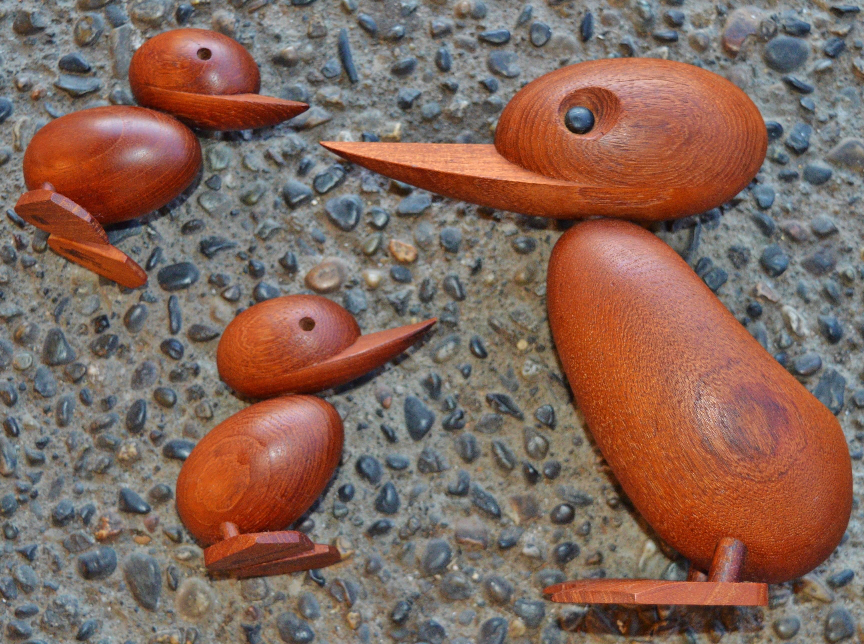 For offer is a Danish teak duck and a pair of duckling figures by Hans Bolling. A classic wooden Danish design toy who can resist these adorable duck and duckling figures? In the Spring of 1959, a policeman stopped the traffic in a busy street in