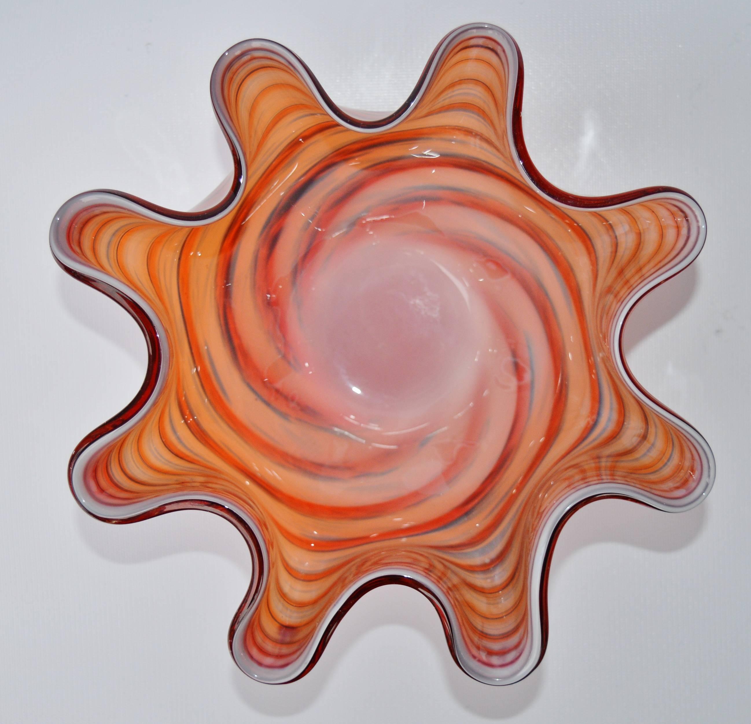 This stunning Murano blown glass handkerchief bowl has the loveliest shades of red, orange and blue with subtle striations and a darker toned that are very unique and dramatic. In excellent vintage condition with no chips or major scratches or