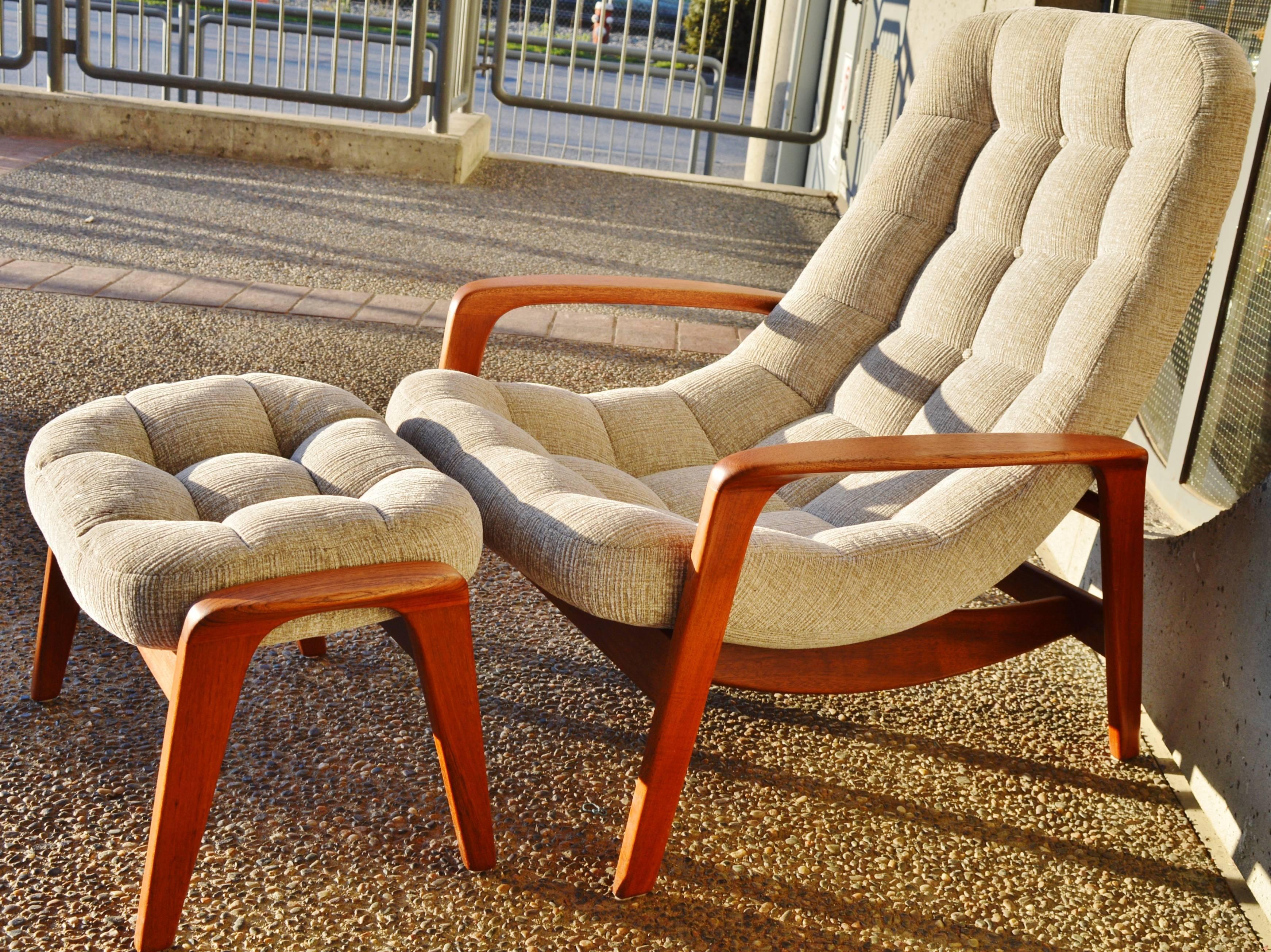 This fabulous Danish modern style teak frame lounger and ottoman were designer by R. Huber & Co. and are one of the most supremely comfortable lounge chairs ever! The curved back of the seat, the generous width, the flared armrests that match the