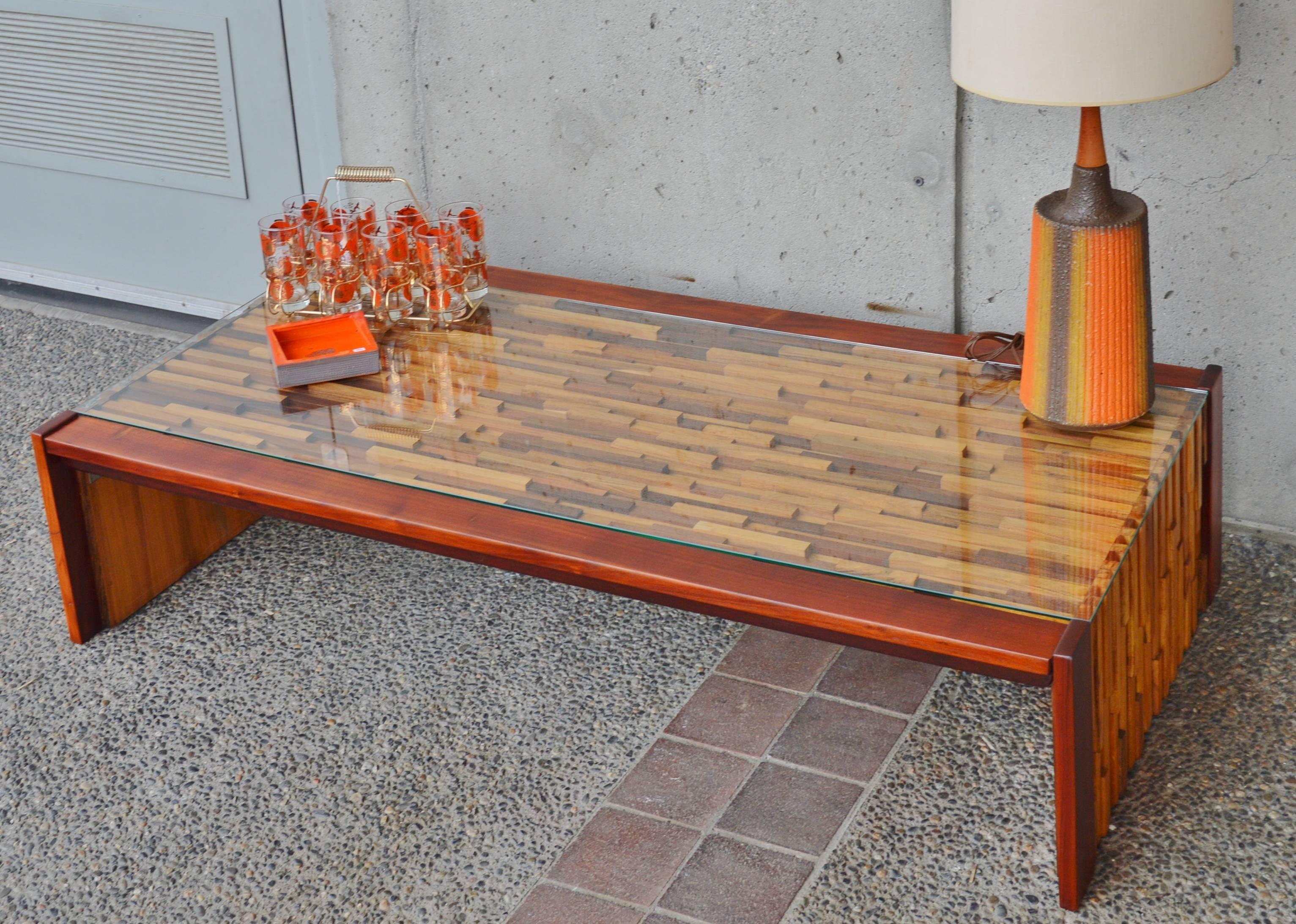 These spectacular set of Brutalist style Mid-Century Modern mosaic coffee tables were designed by Percival Lafer in solid pieces of tropical hardwoods including rosewood, teak and jacaranda. The set includes a large, rectangular coffee table and a