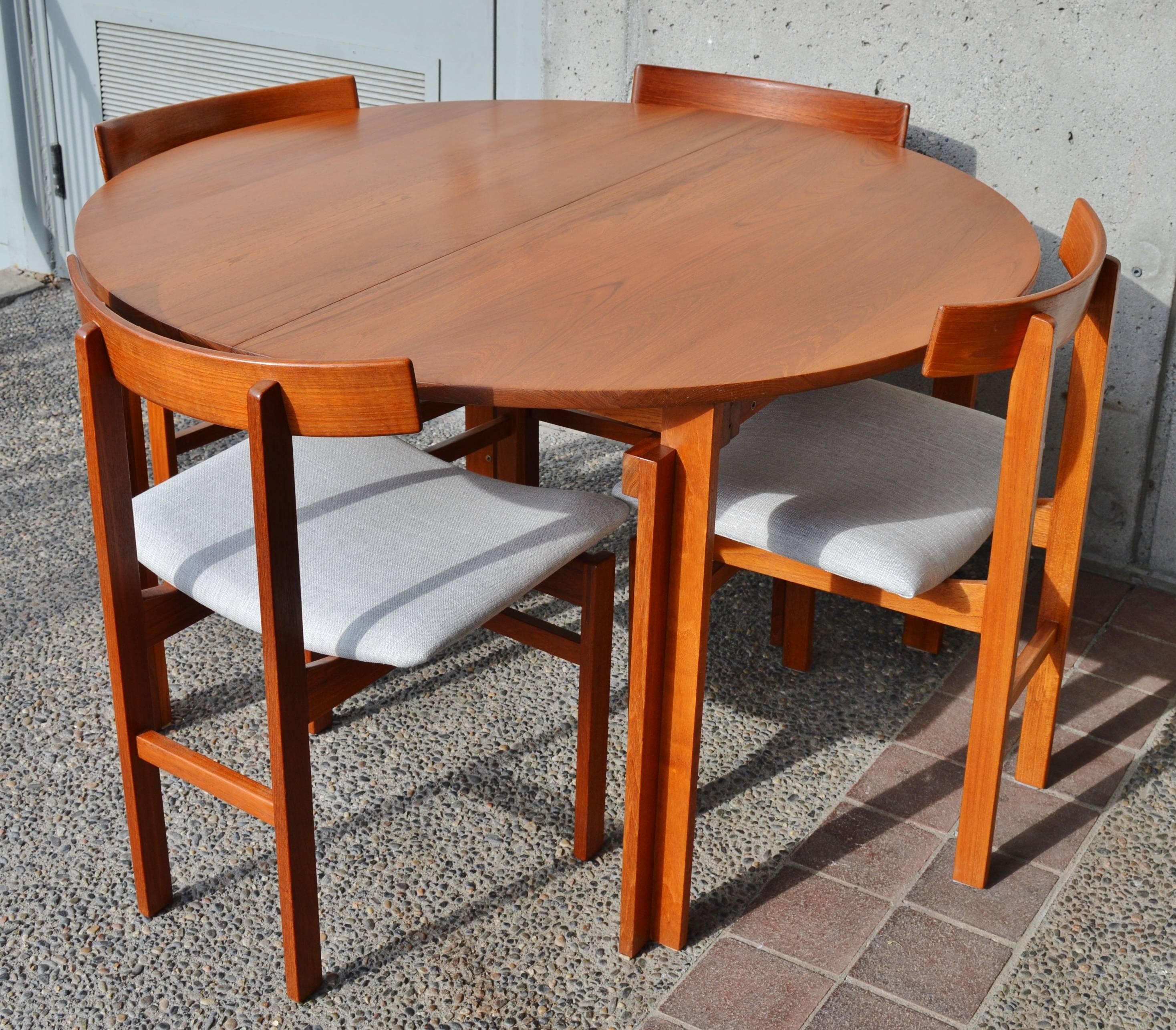 This incredibly rare Danish modern teak dining set was designed by Inger Klingenberg for France & Sons in the 1950s and is clearly marked with the France & Sons medallion on the chairs as well as the dining table and yet we could only find one other