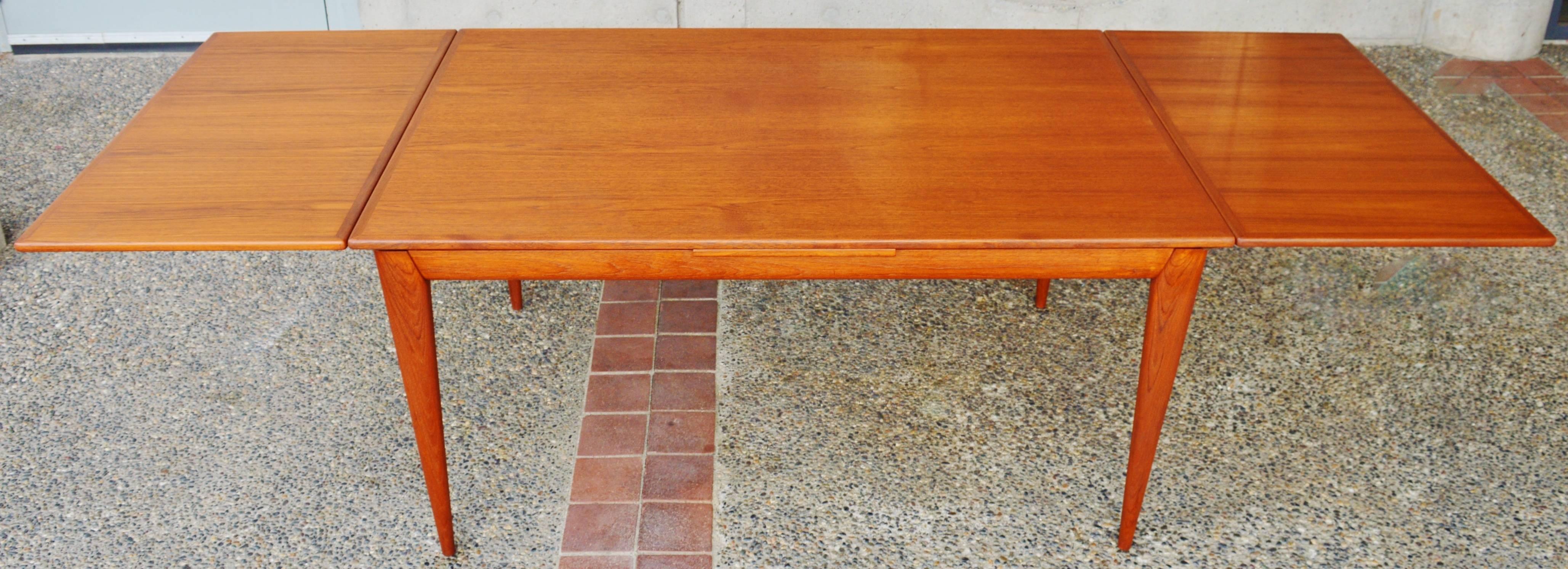 Scandinavian Modern Impeccable No Moller Rare Teak Extending Dining Table with Sexy Apron and Legs