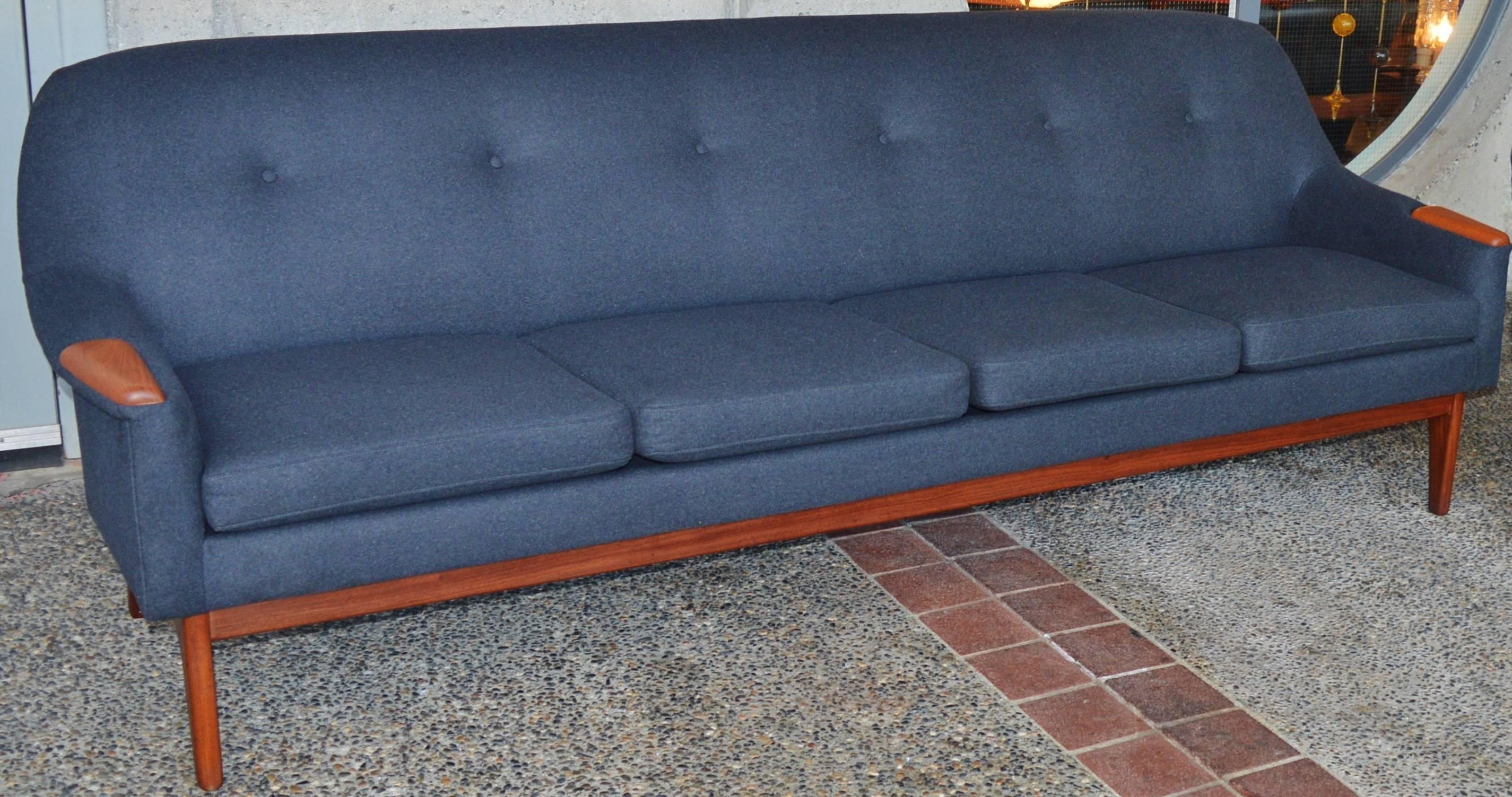 This totally hot Danish Modern teak sofa is just divine and super comfortable! Completely restored with all new Pirelli rubber strapping, quality foam and soft, charcoal felted wool. Note the lovely contouring around the outside of the armrests, the