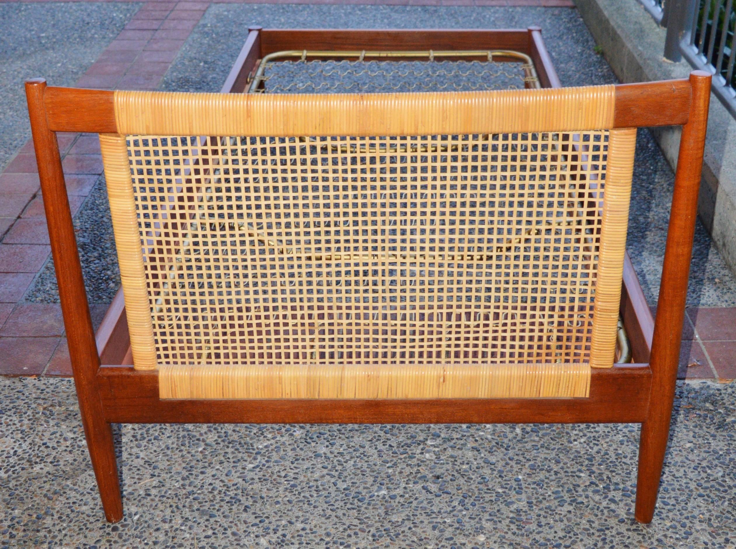 This lovely quality Danish modern teak twin or singled bedframe is gorgeous and beautifully constructed. The frame disassembles for convenient shipping and features a sculptural headboard with wrapped and basket woven caning. In excellent condition,