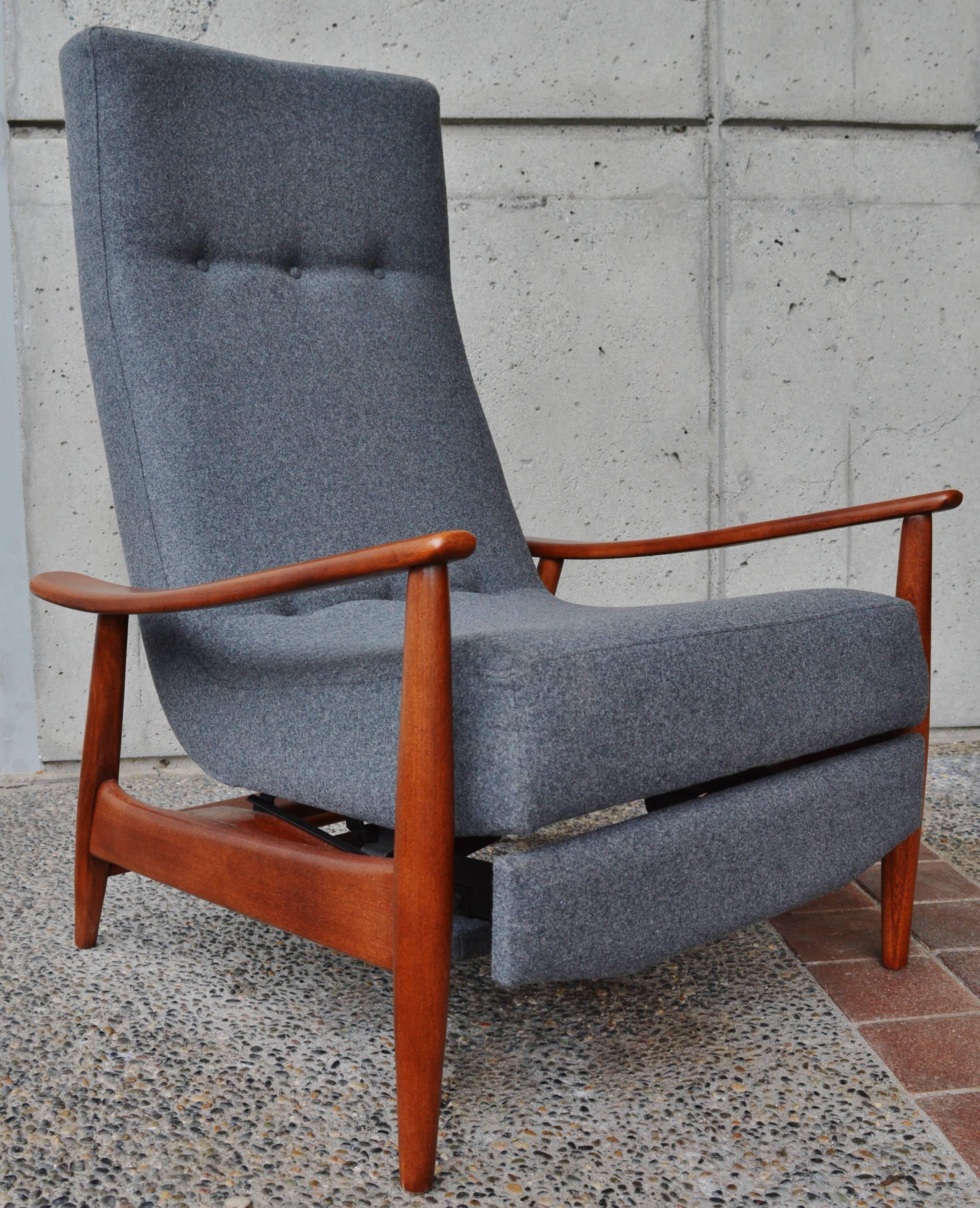 This amazing Danish modern walnut frame recliner is the kind of Lazy Boy you'd be happy to have in your home! Featuring a slim profile seat with button tufted wool, completely redone with new strapping, foam and professionally upholstery in a lovely